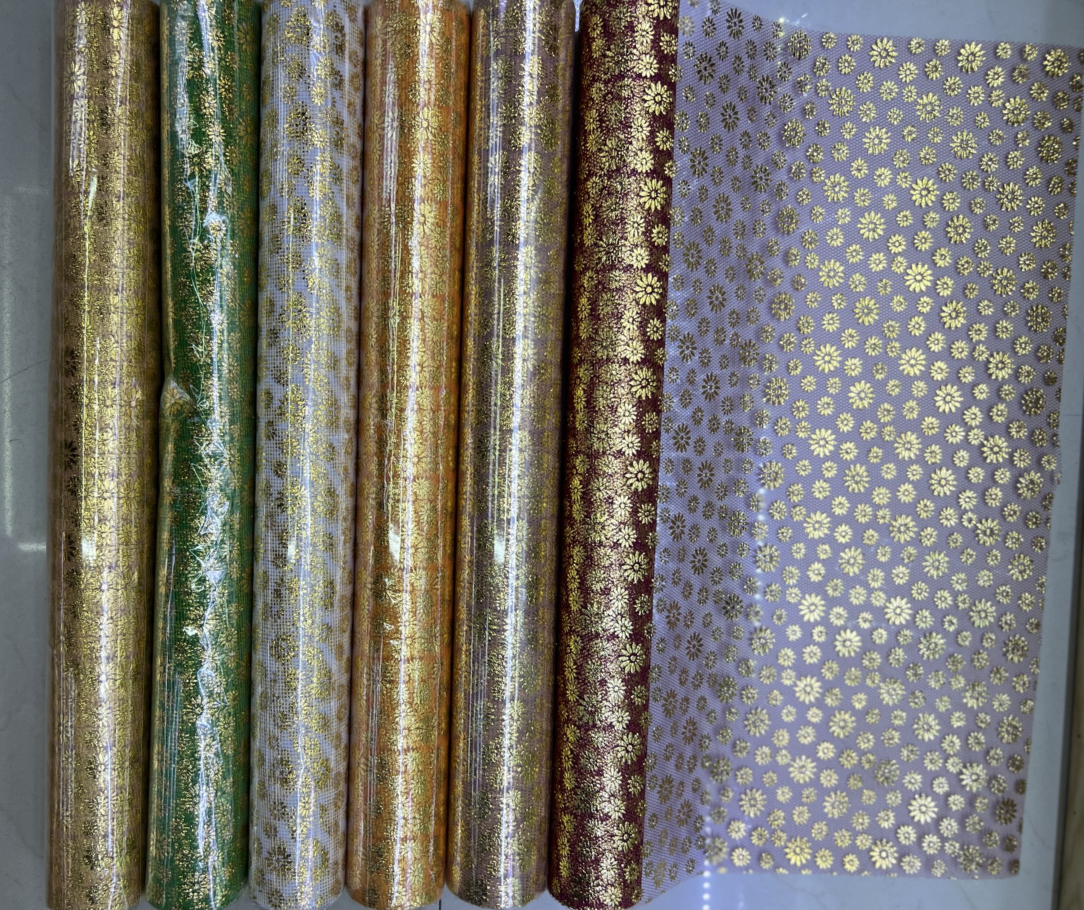 Gilded cat paw print mesh fabric