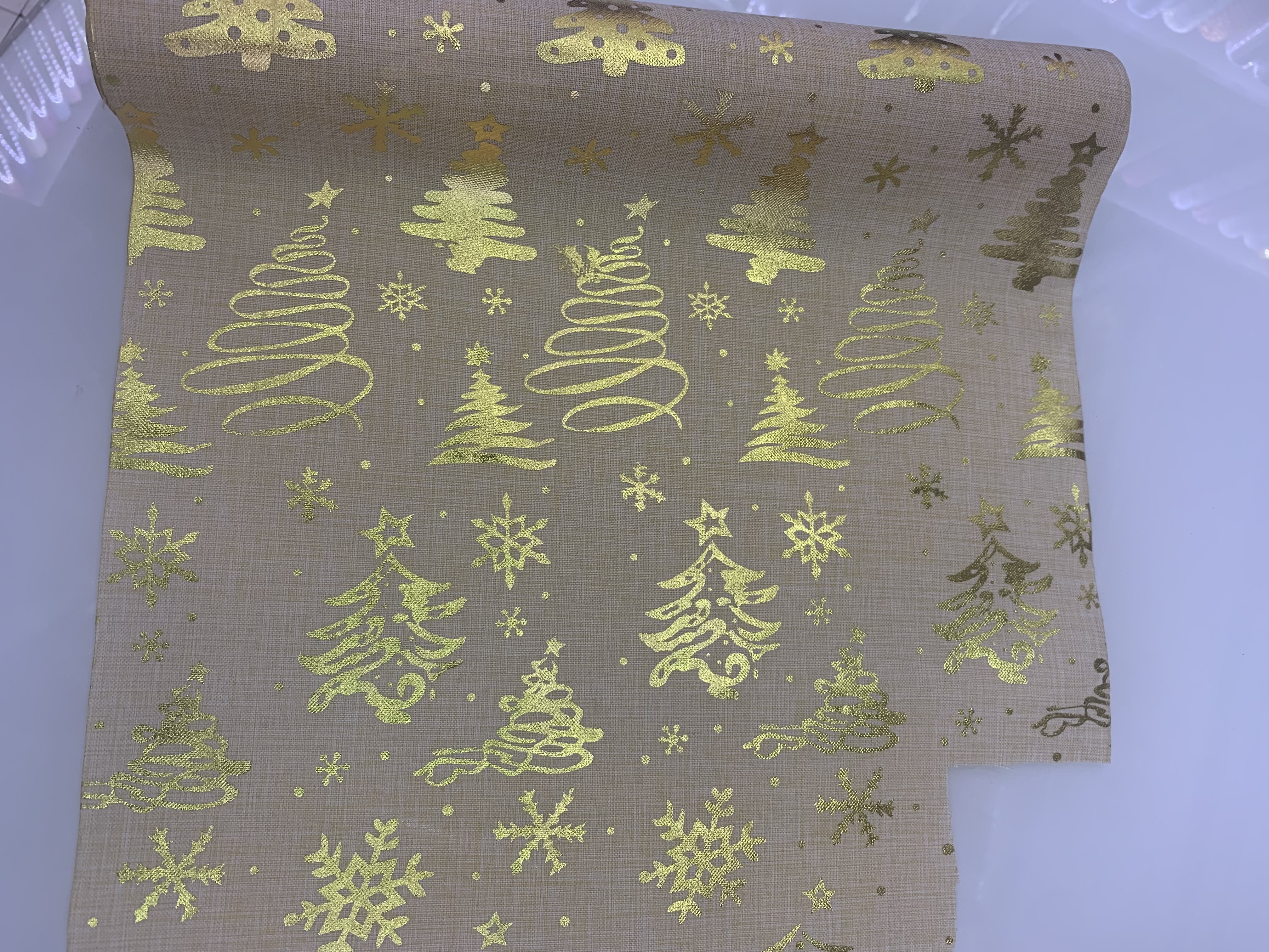 A faux linen gilded Christmas tree