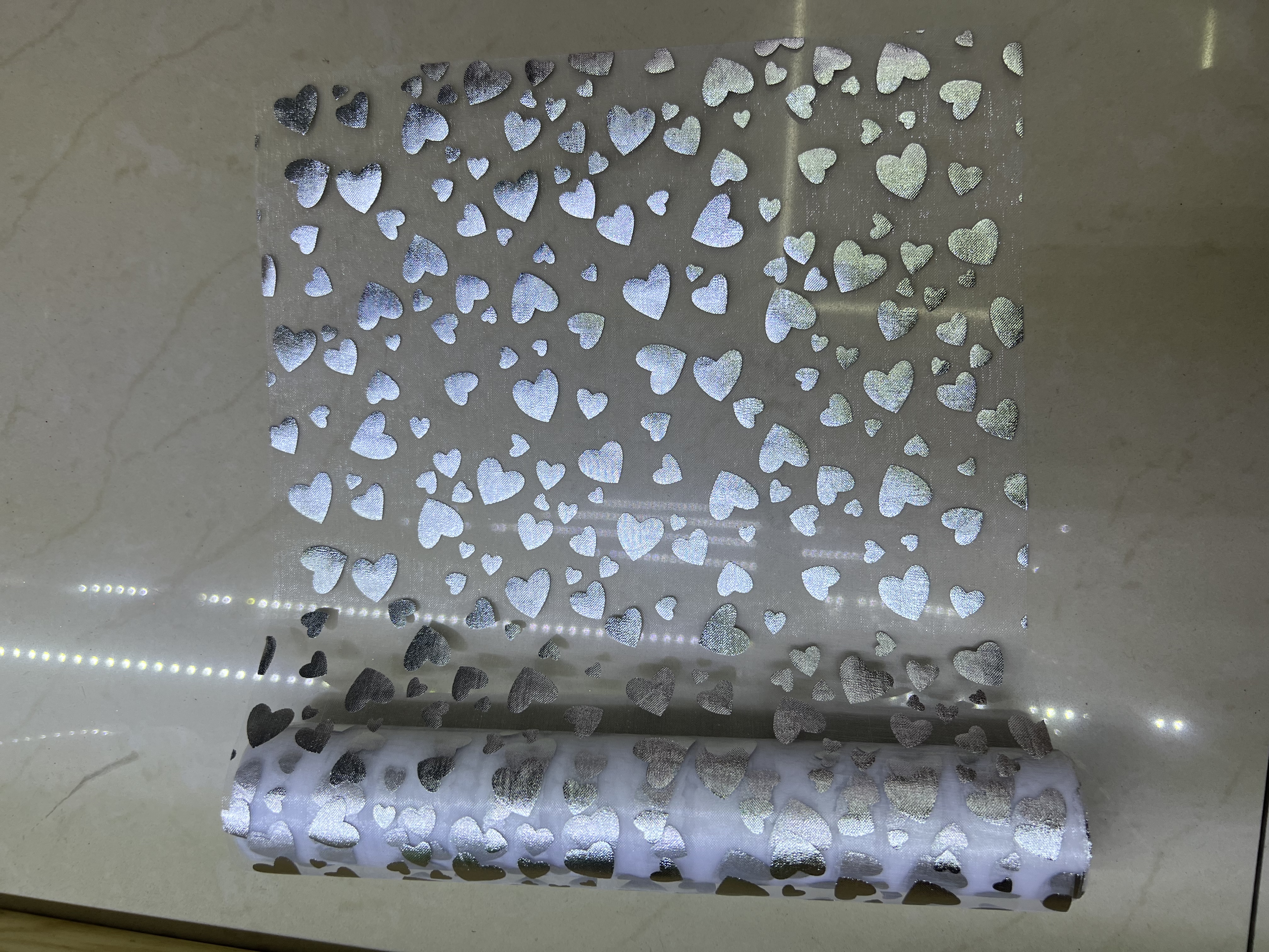 Gold-embossed heart-shaped gauze roll