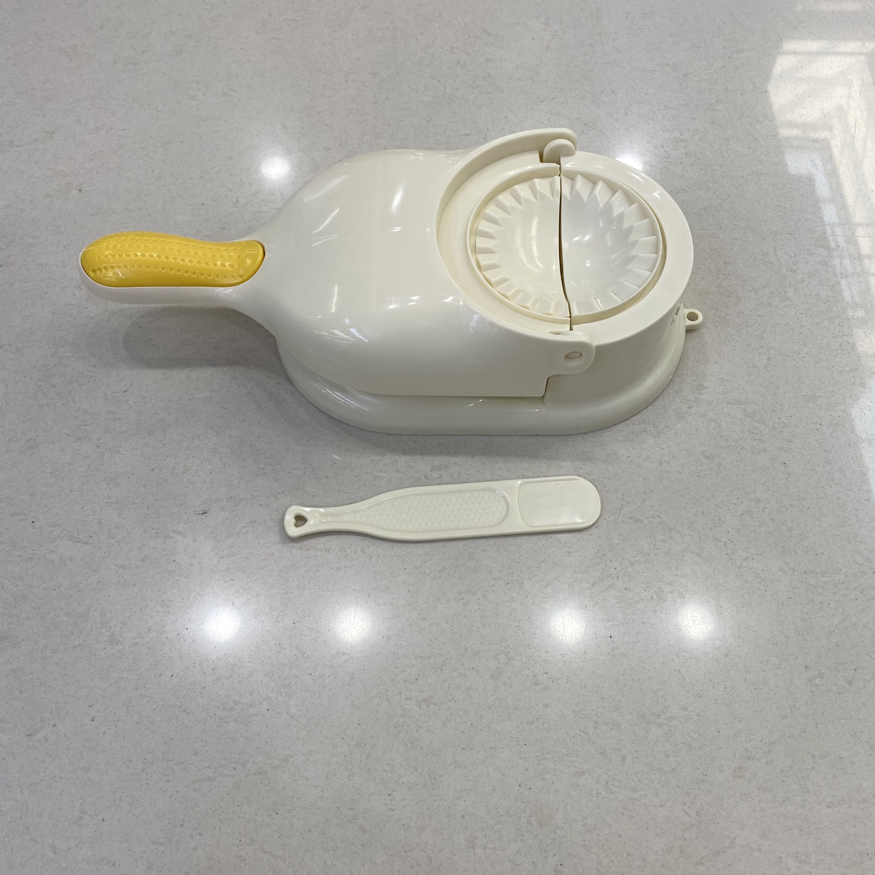 A manual dough rolling machine for pressing dumpling wrappers, a perfect tool for making dumplings