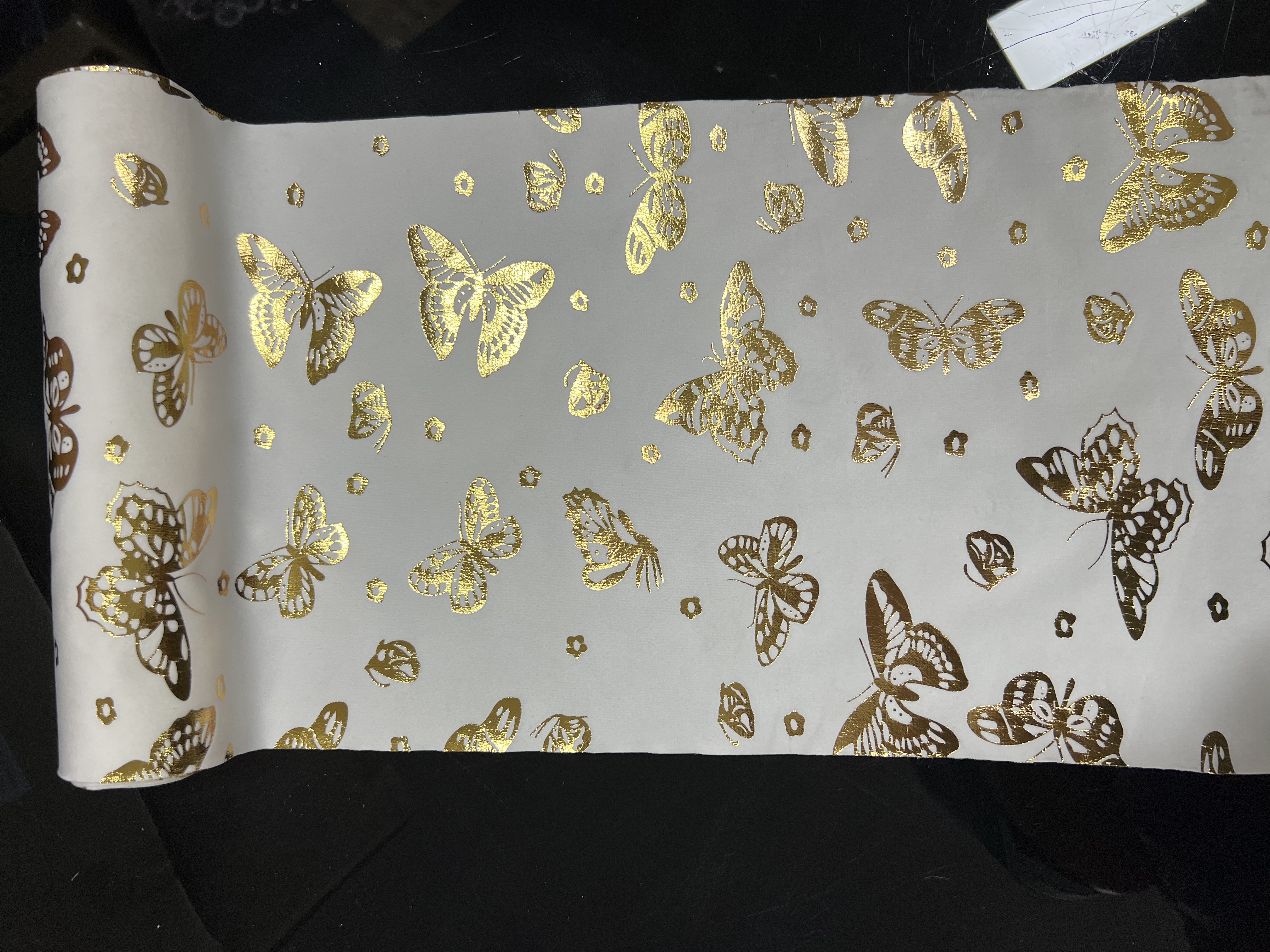 Gold-embossed butterfly on flannel