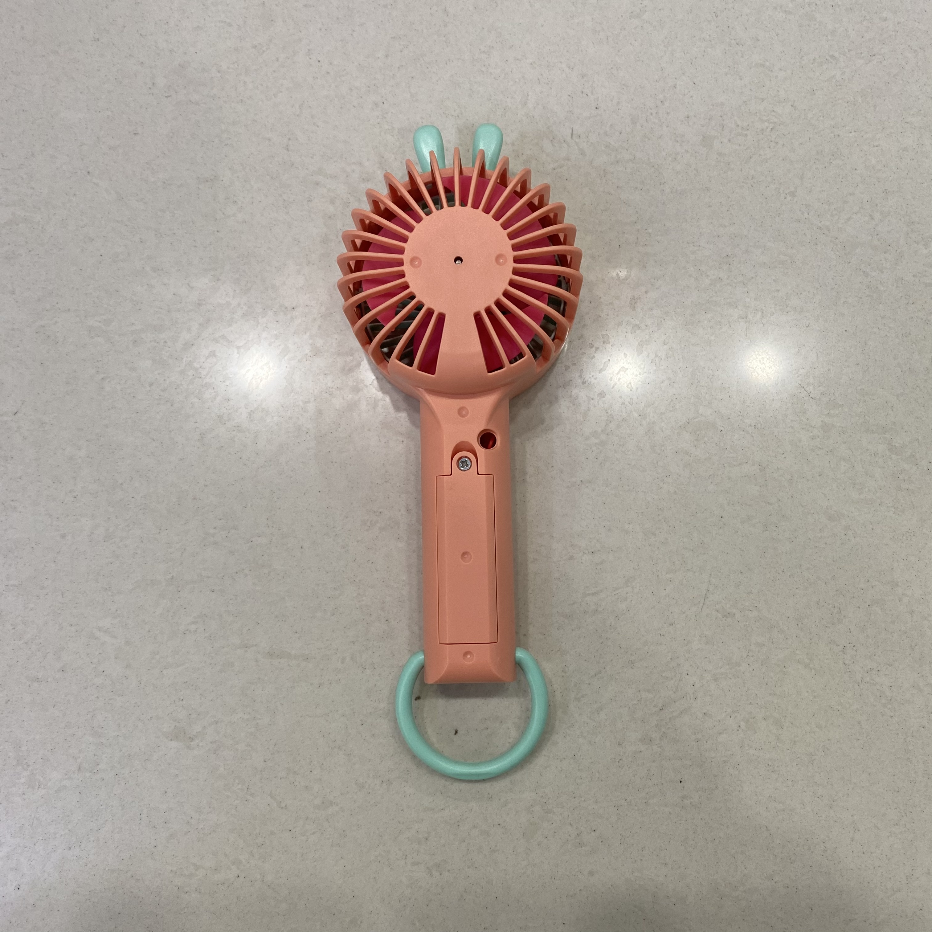 The handheld charging fan can be used as a phone stand for convenient handheld mini student fans Application Scenario