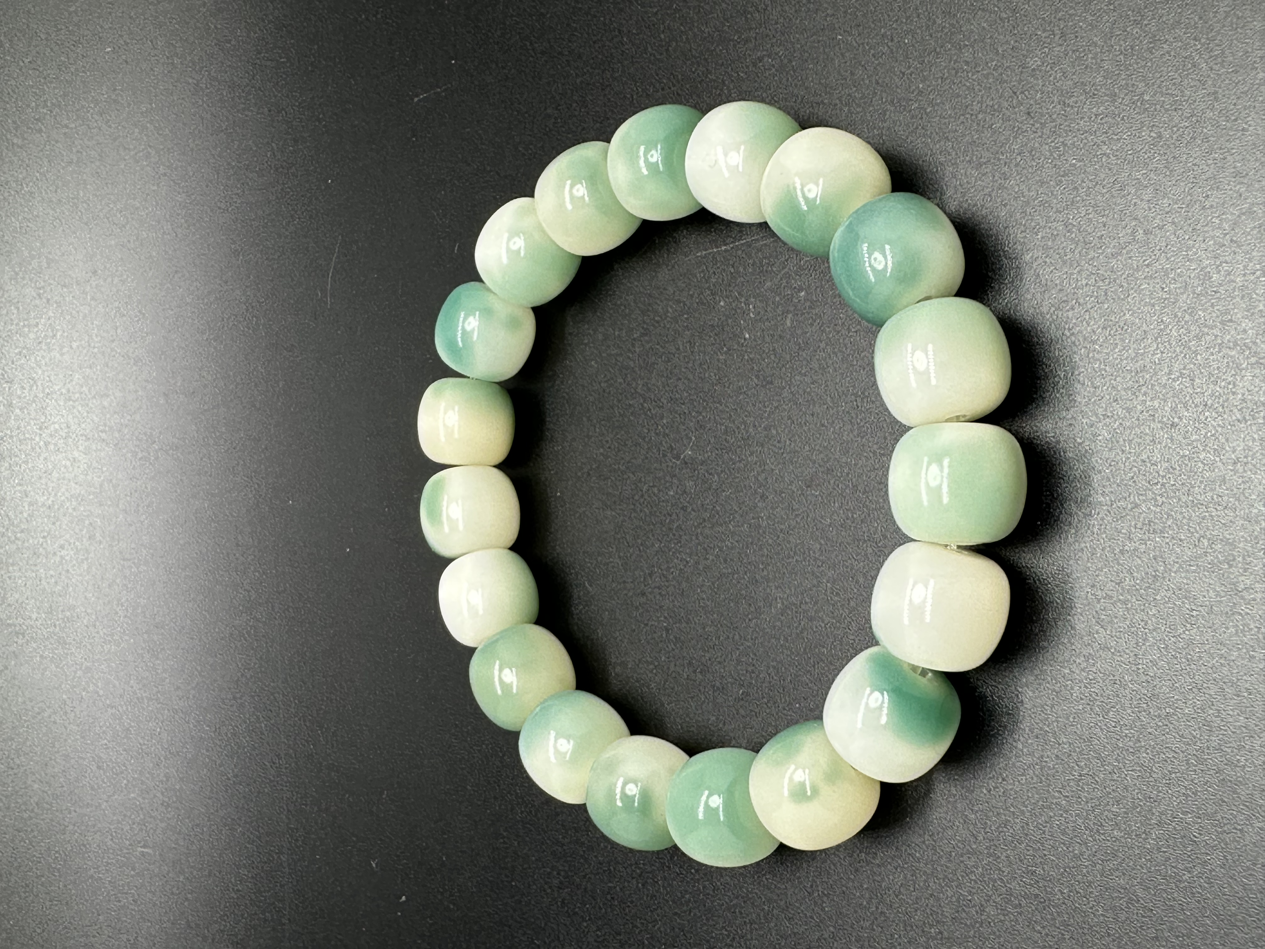 Ink flower-patterned white jade Bodhi plate playing hand beads: 8091 Xiangyuan Buddhist Beads, Zone D, 3rd Floor, Phase I of Yiwu International Trade City details Picture