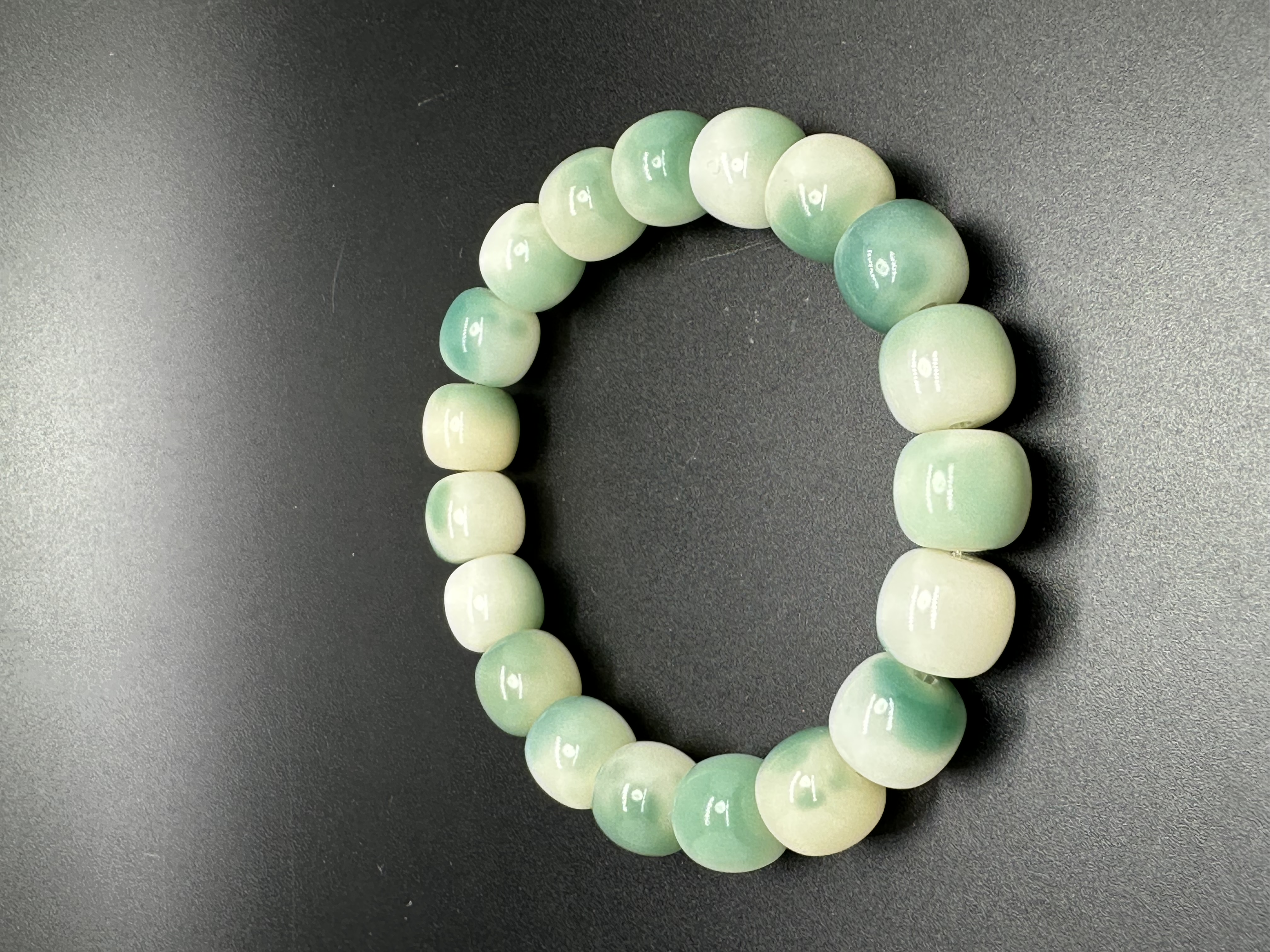 Ink flower-patterned white jade Bodhi plate playing hand beads: 8091 Xiangyuan Buddhist Beads, Zone D, 3rd Floor, Phase I of Yiwu International Trade City Item Picture