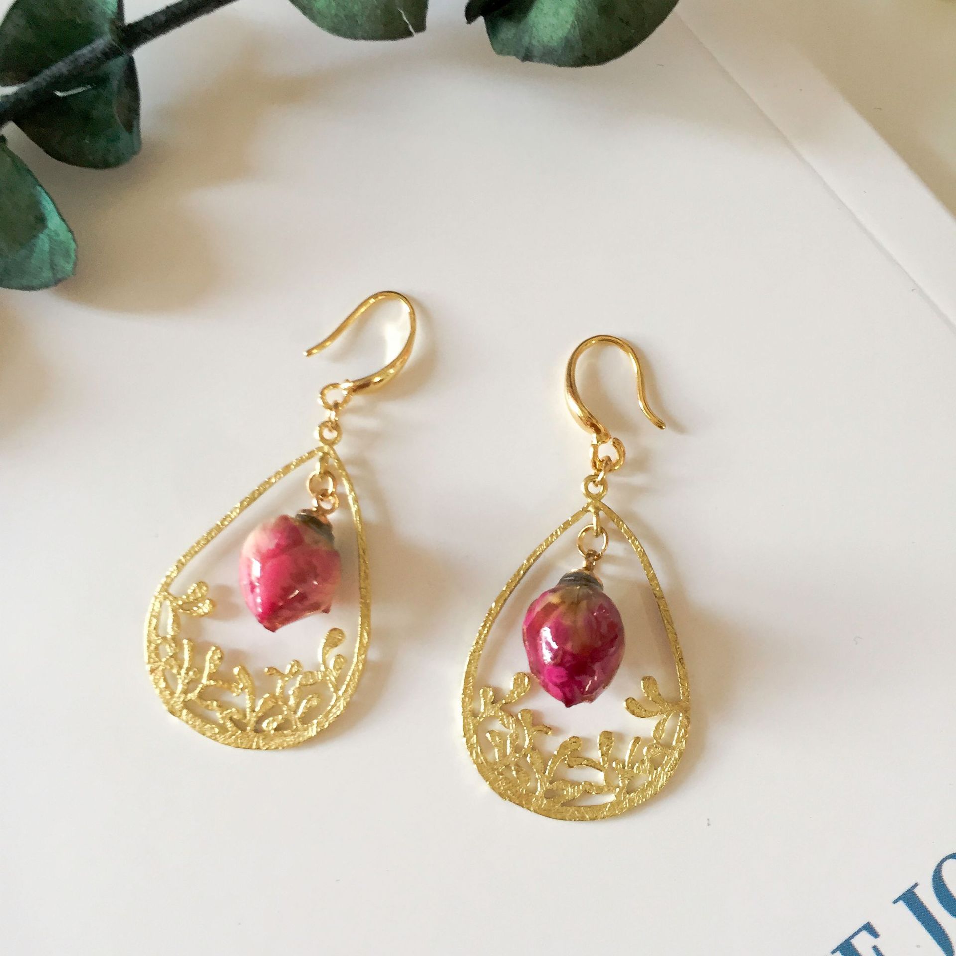 The golden hollowed-out carved rose earrings are adorned with retro and exquisite rose buds, exuding an elegant and courtly charm pic 3