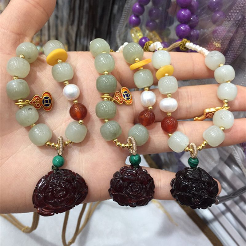 Bright crystal jewelry, natural Hetian jade with blood amber pendant necklace, exquisitely carved with water head foot, smooth and fine surface