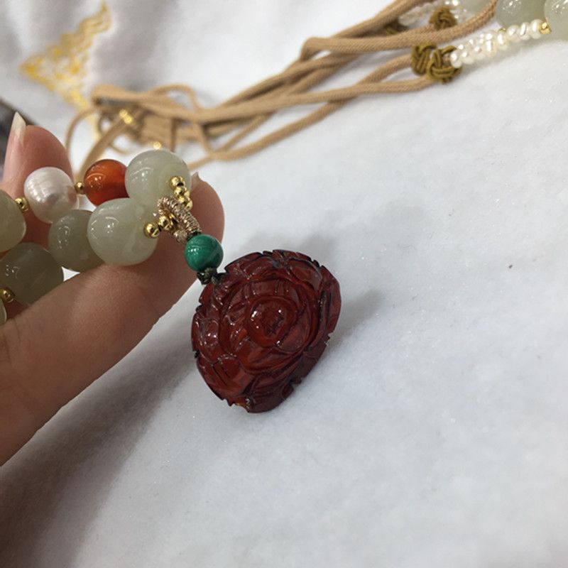 Bright crystal jewelry, natural Hetian jade with blood amber pendant necklace, exquisitely carved with water head foot, smooth and fine surface Item Picture