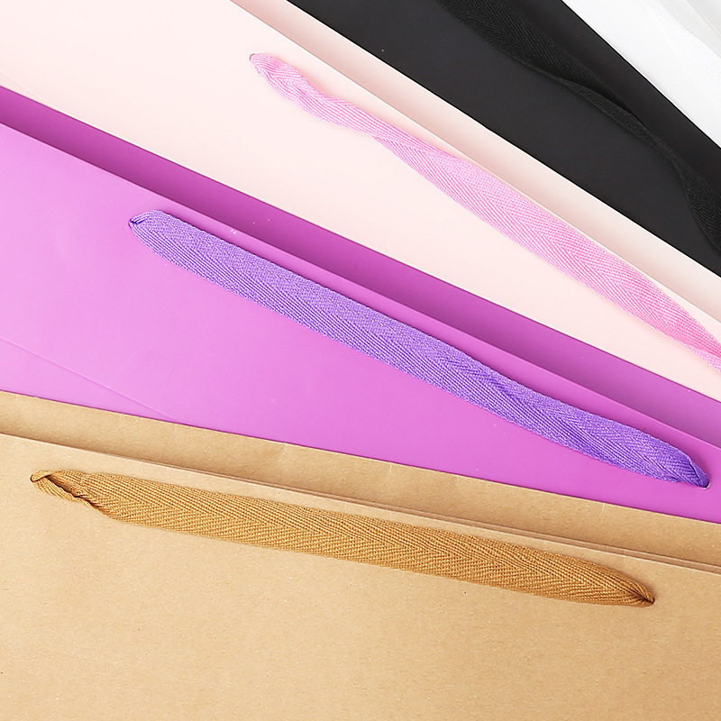 Large long flower paper bags, universal clothing packaging paper bags, shopping hand-held paper bags Specification image