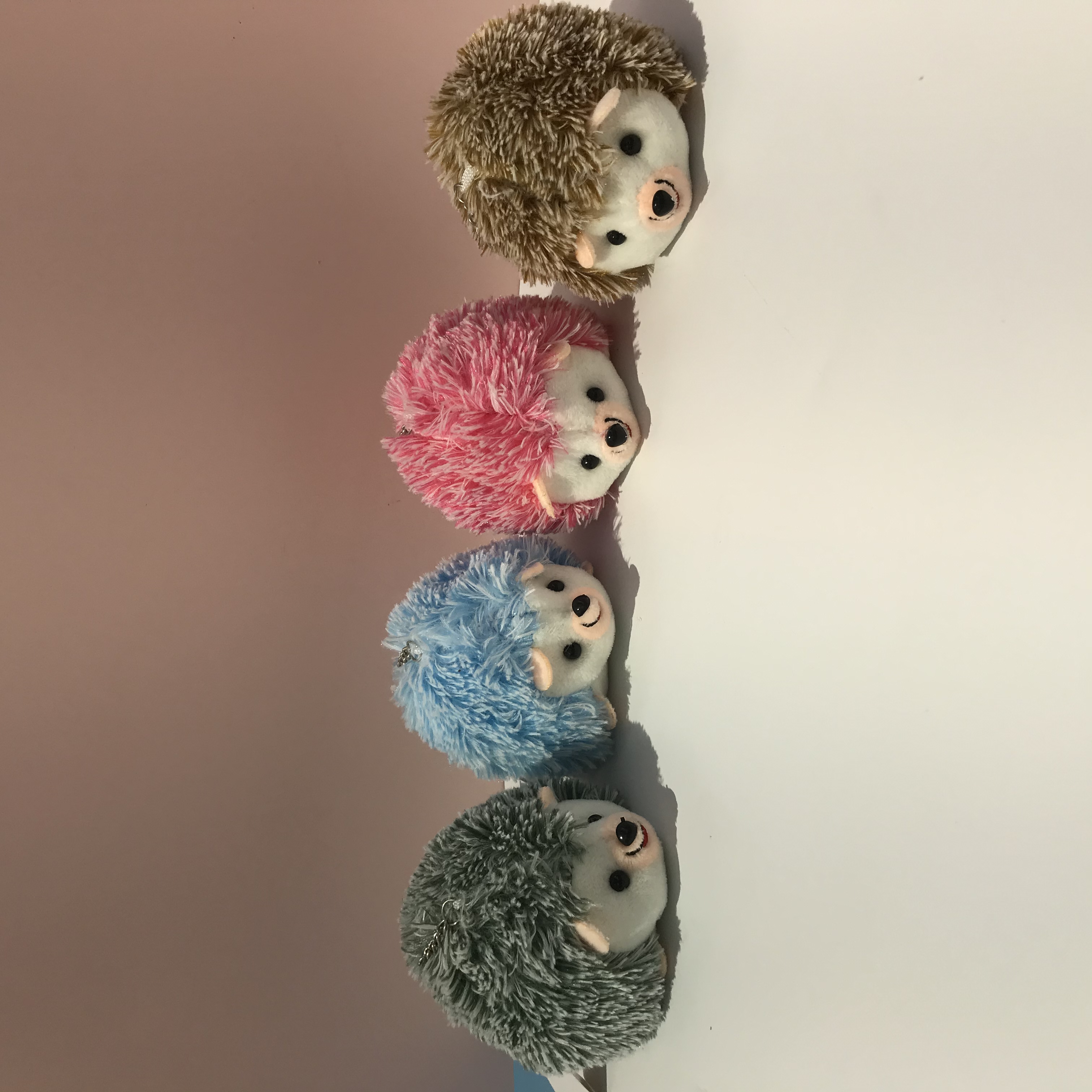 Cartoon dolls, plush toy pendants, toy backpacks, mobile phone keychains, pendants, 10cm hedgehog in a prone position, hedgehog bestsellers, long-haired hedgehogs, 4-color cute hedgehog pendants, keychains, customizable