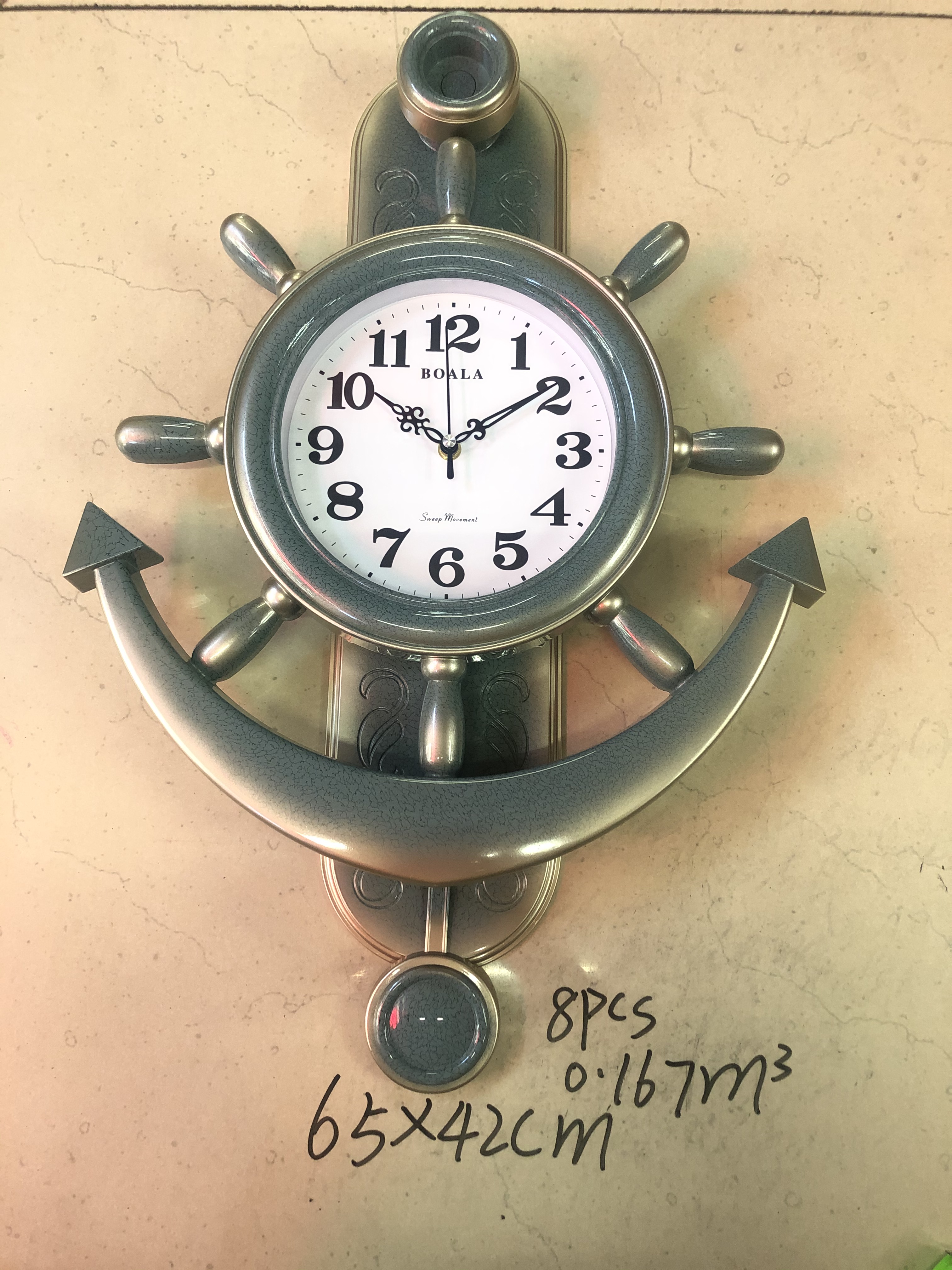 A plastic wall clock for the rudder