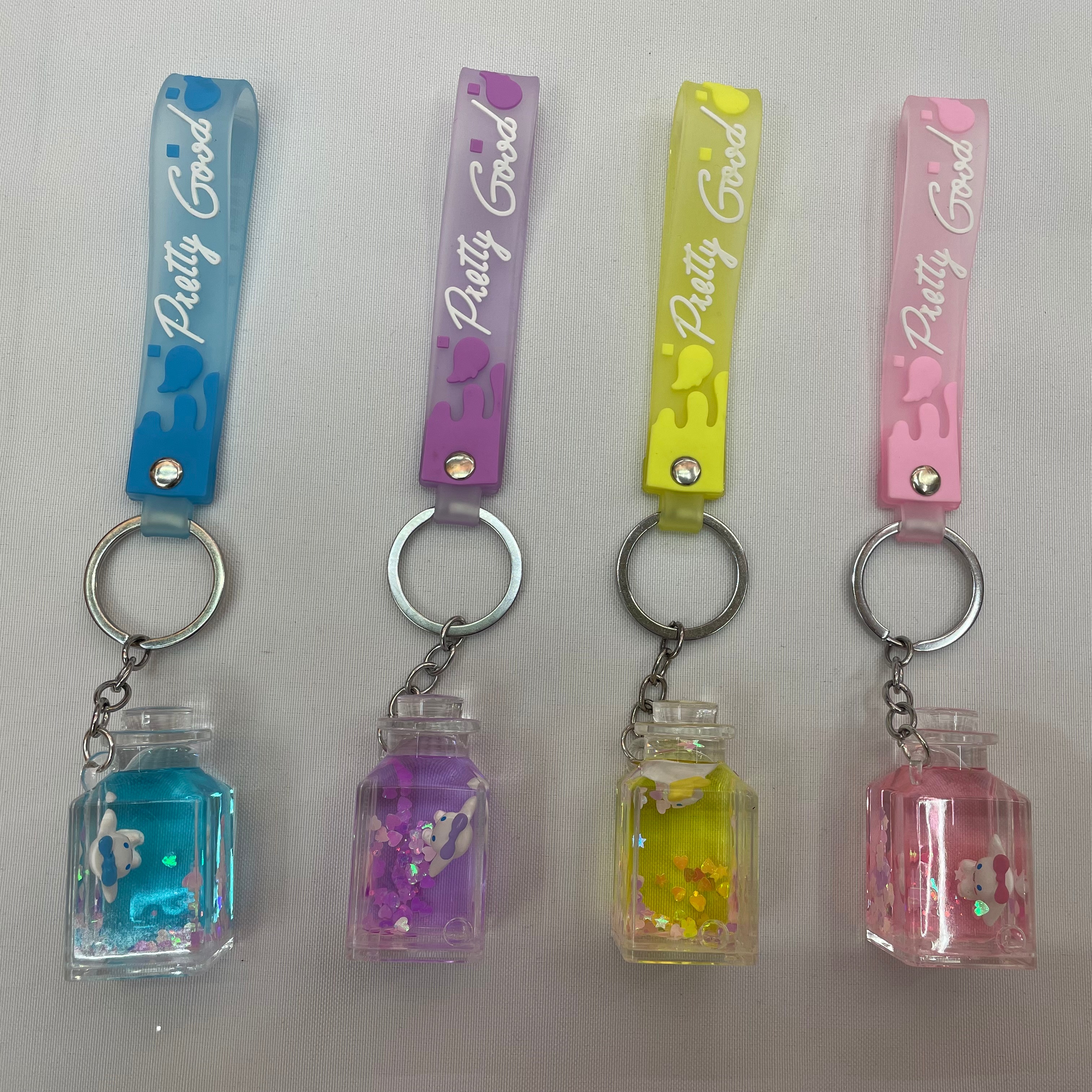 Cute drift bottle, flowing sand liquid floating acrylic pendant, creative cartoon dog floating in oil keychain, schoolbag hanging decoration details Picture