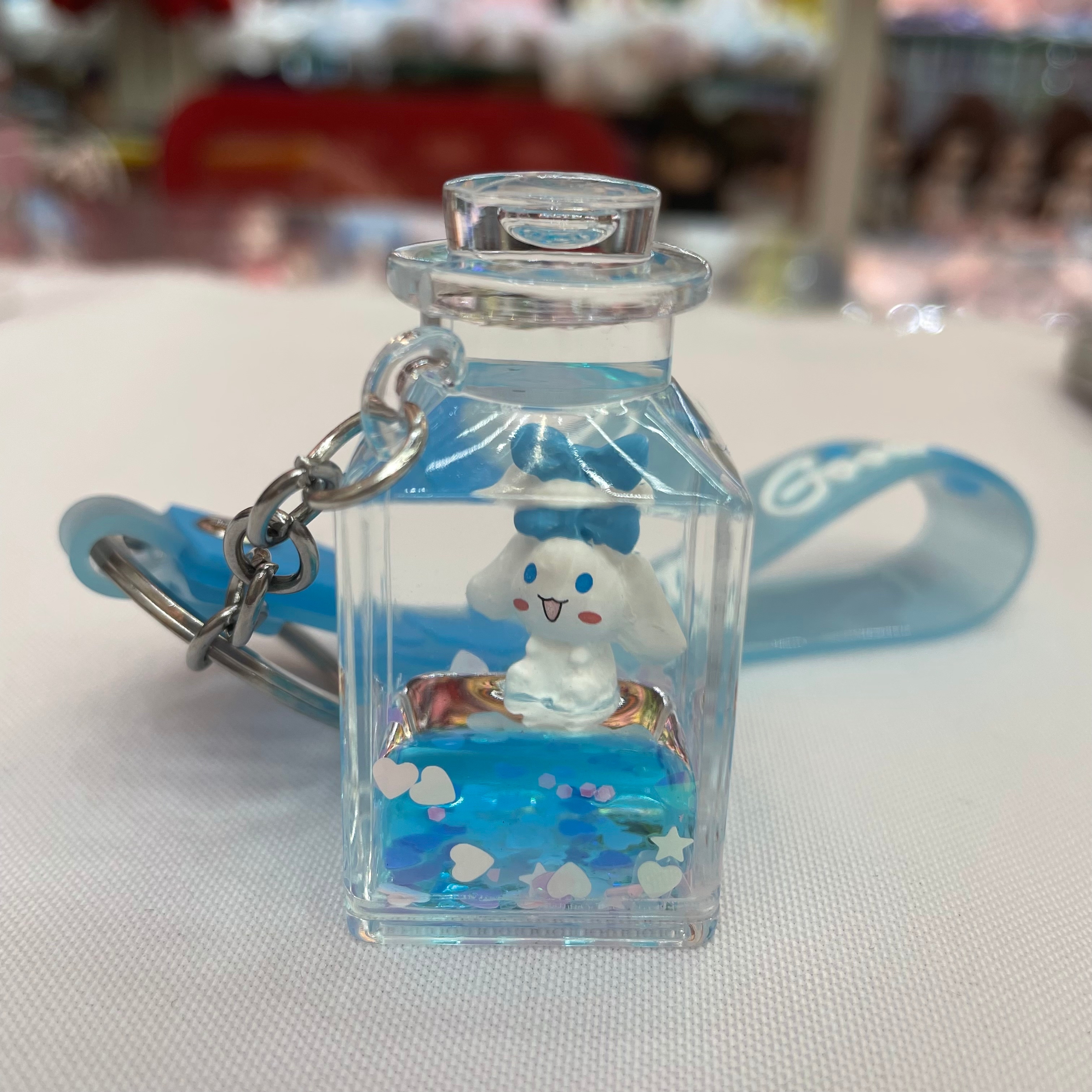 Cute drift bottle, flowing sand liquid floating acrylic pendant, creative cartoon dog floating in oil keychain, schoolbag hanging decoration Application Scenario