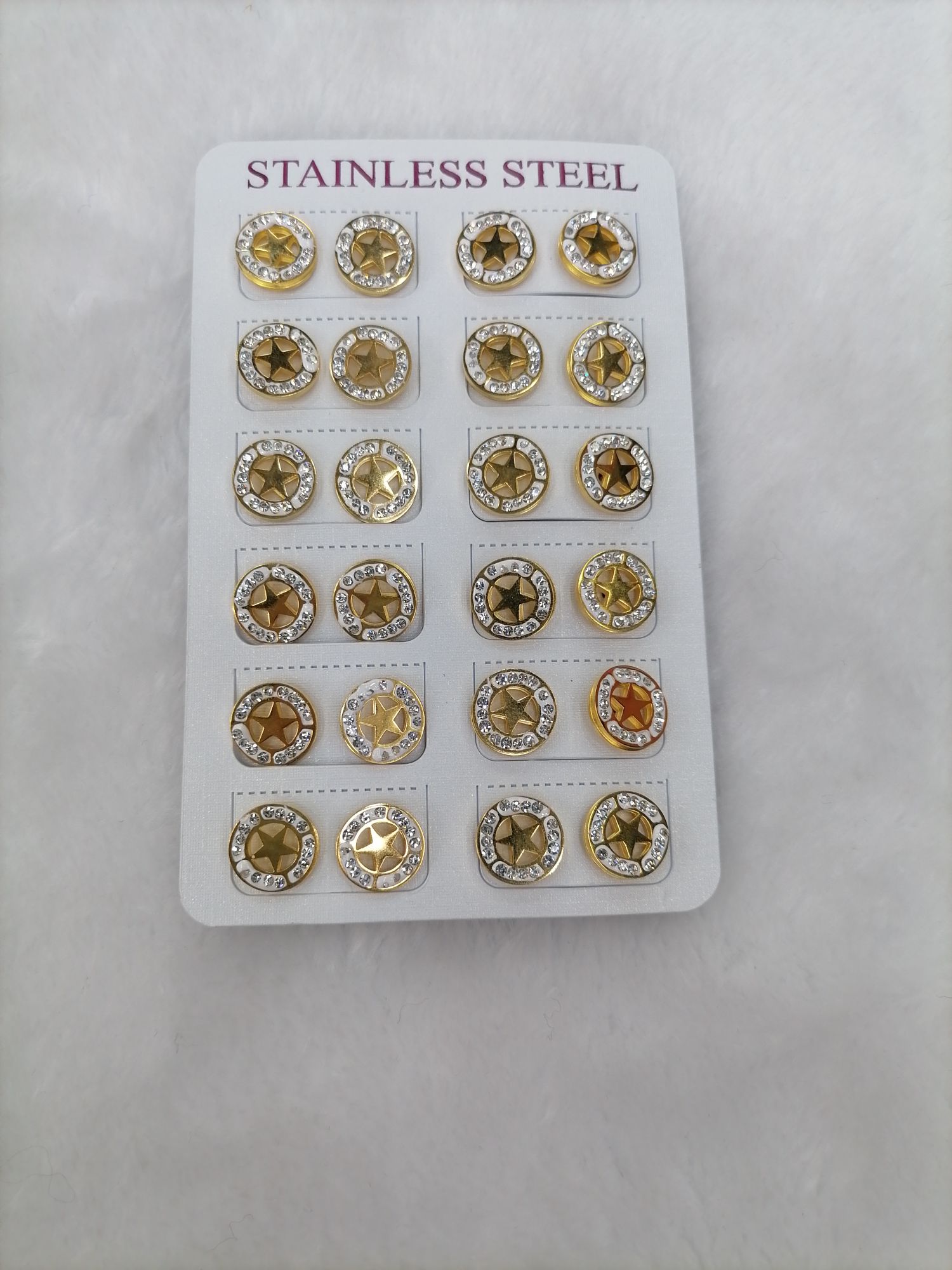 Titanium steel golden hollowed-out five-pointed star with diamond stud earrings