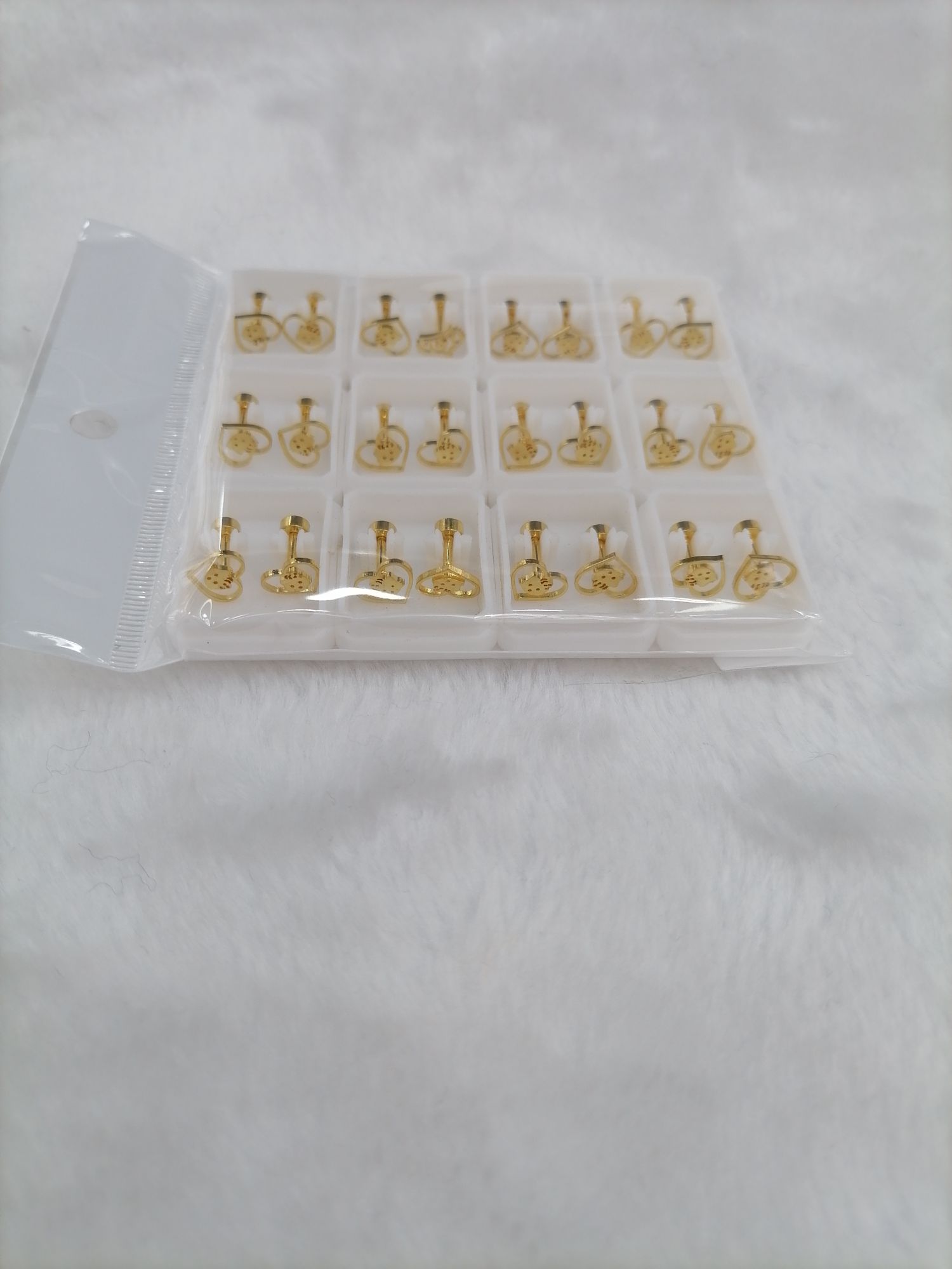 Titanium steel golden hollowed-out cat ear studs Specification image