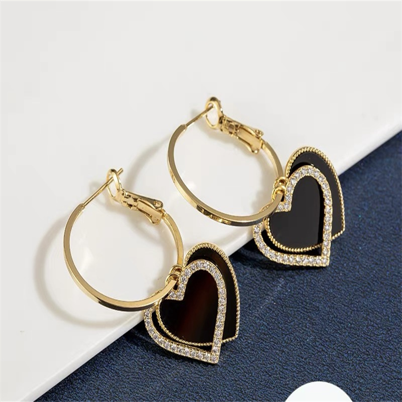 Dingxin Accessories Earrings 9120026, a popular new product in foreign trade, offers fashionable metal earrings with a European and American style. Wholesale supply from the manufacturer Specification image