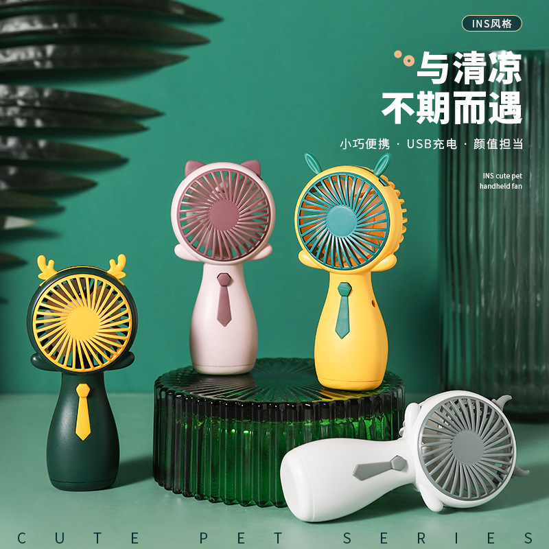 Holding a mini fan details Picture
