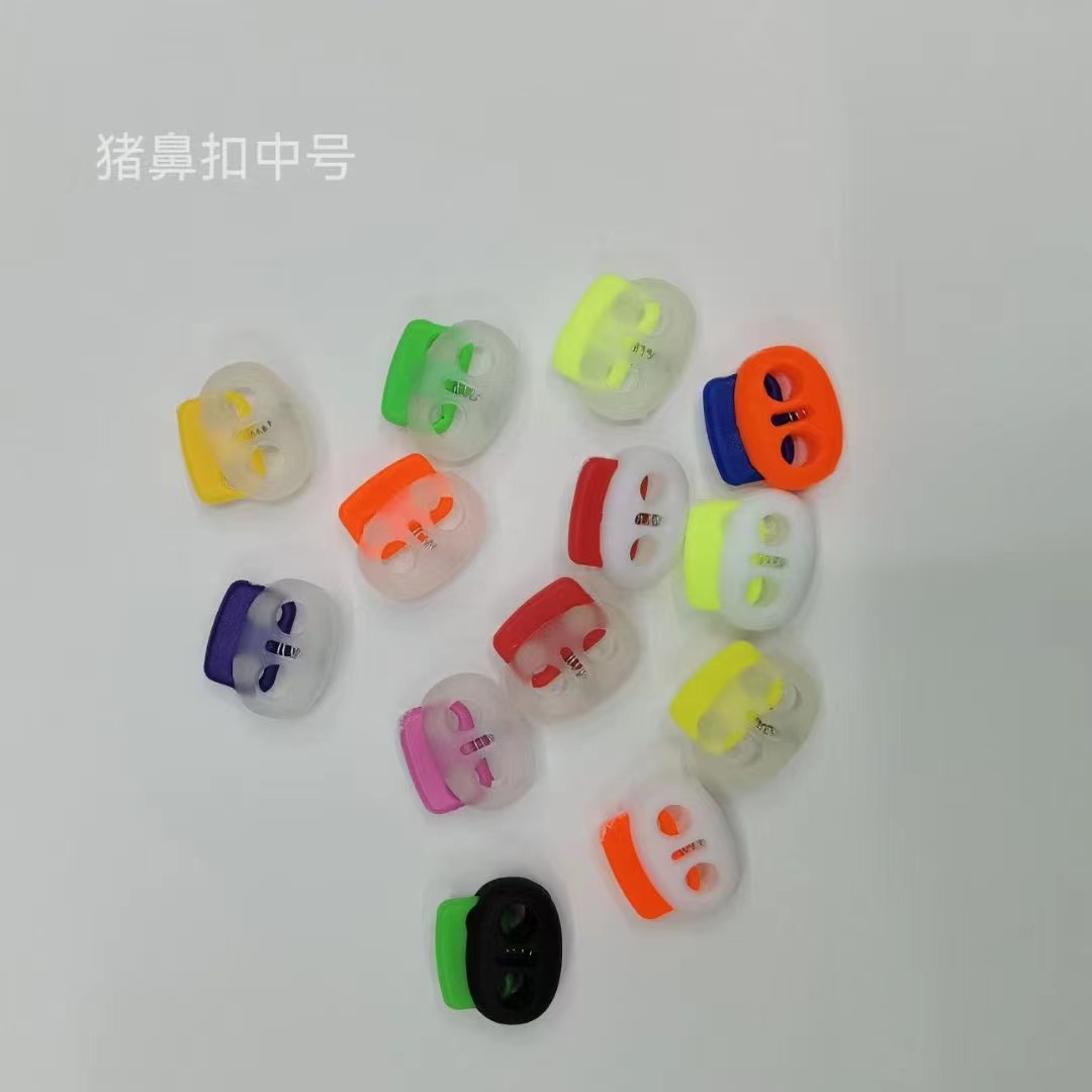 Double-color round mushroom-shaped plastic pig nose rope buckle, spring snap buckle, nylon string buckle, luggage and clothing decoration, pull-out adjustment buckle Application Scenario