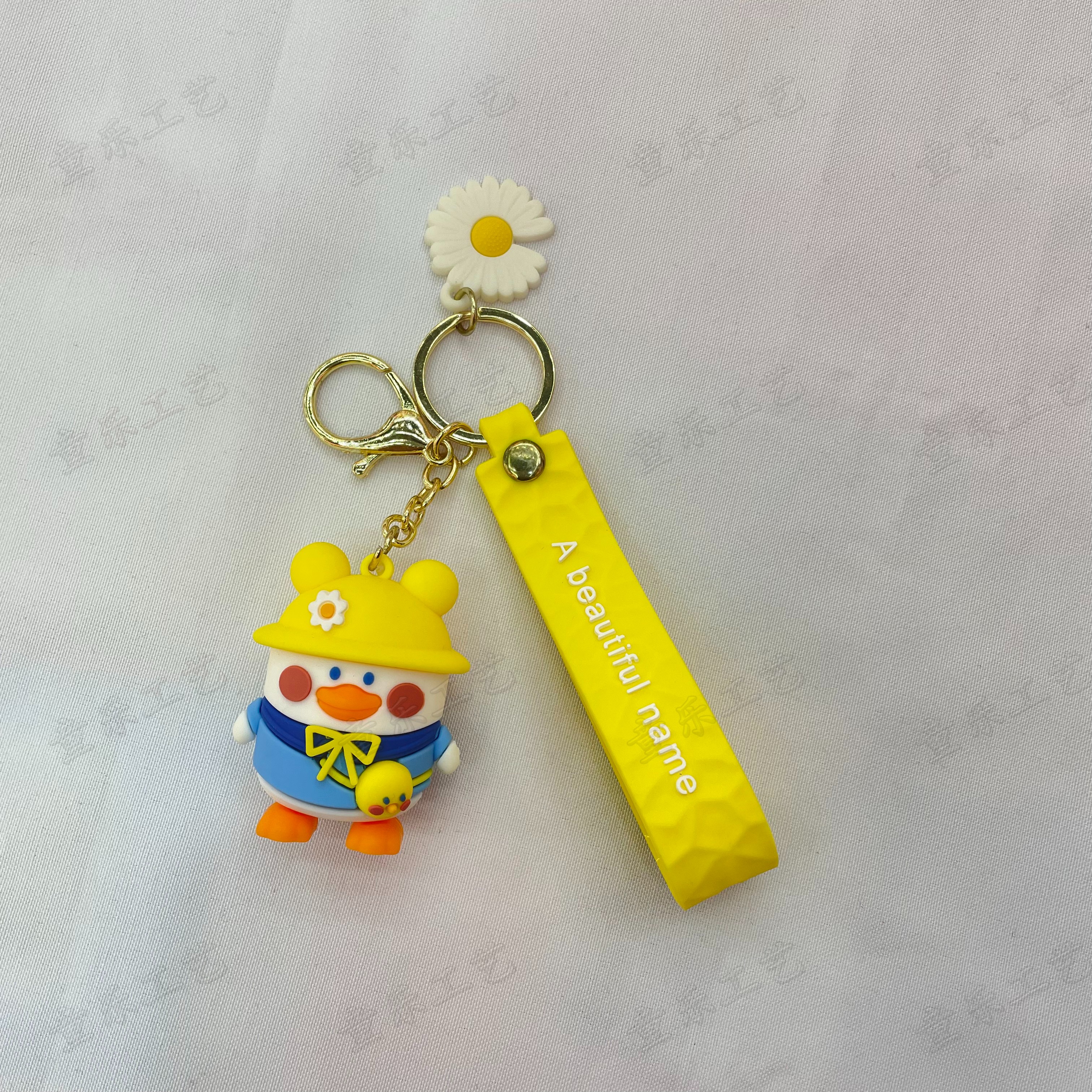 Cute cartoon Internet celebrity duck doll keychain, girls' schoolbag doll pendant, couple exquisite car key chain pendant details Picture