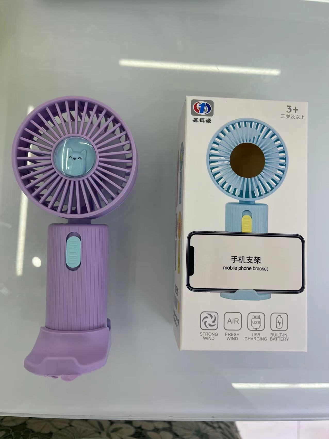 The SQ-326 mini fan has one setting and comes in four colors: purple, blue, pink and yellow. It can be used as a phone stand