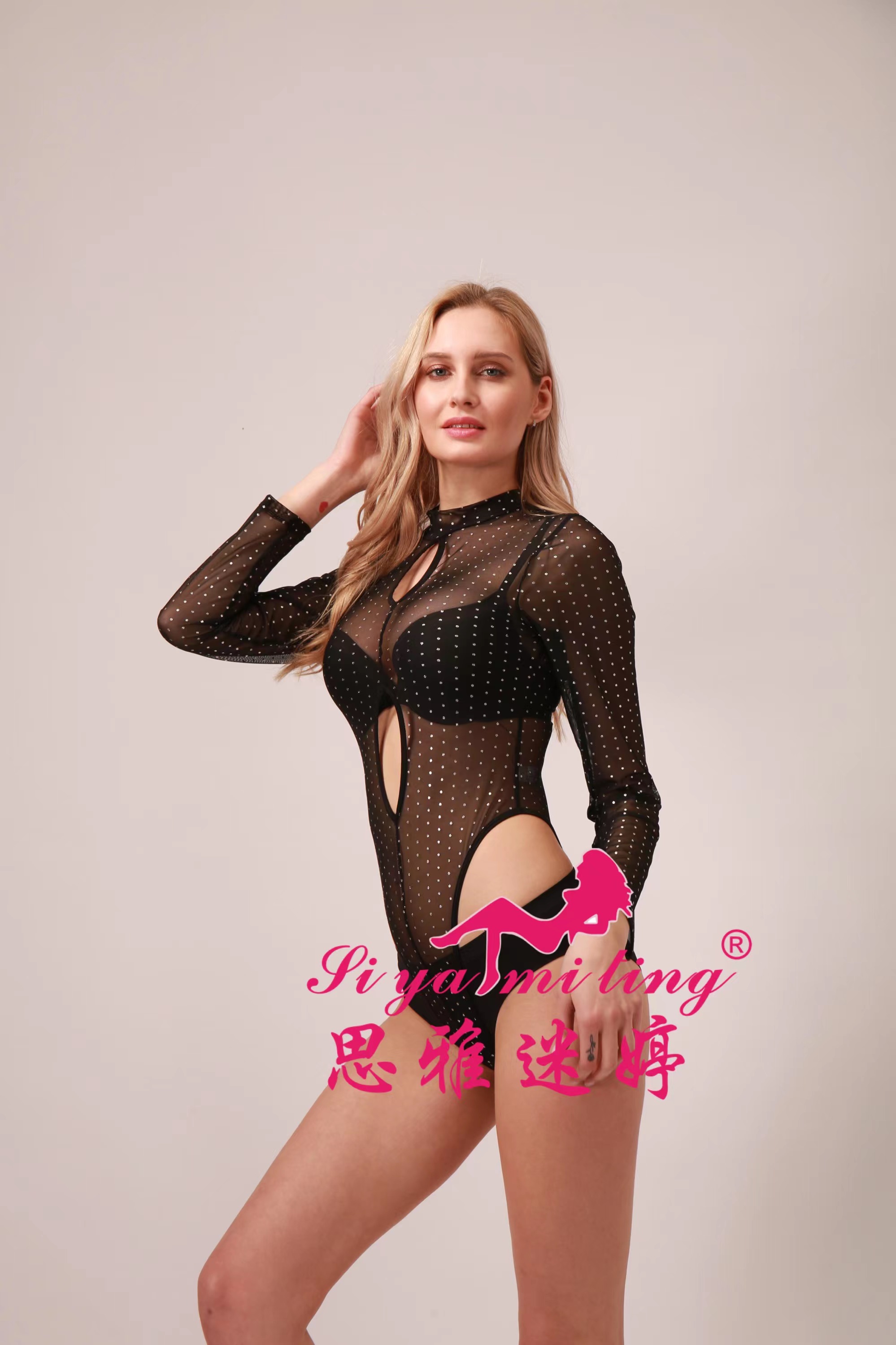 Sexy and seductive long-sleeved, transparent, alluring and charming tight-fitting jumpsuit with cutouts on the bed Application Scenario
