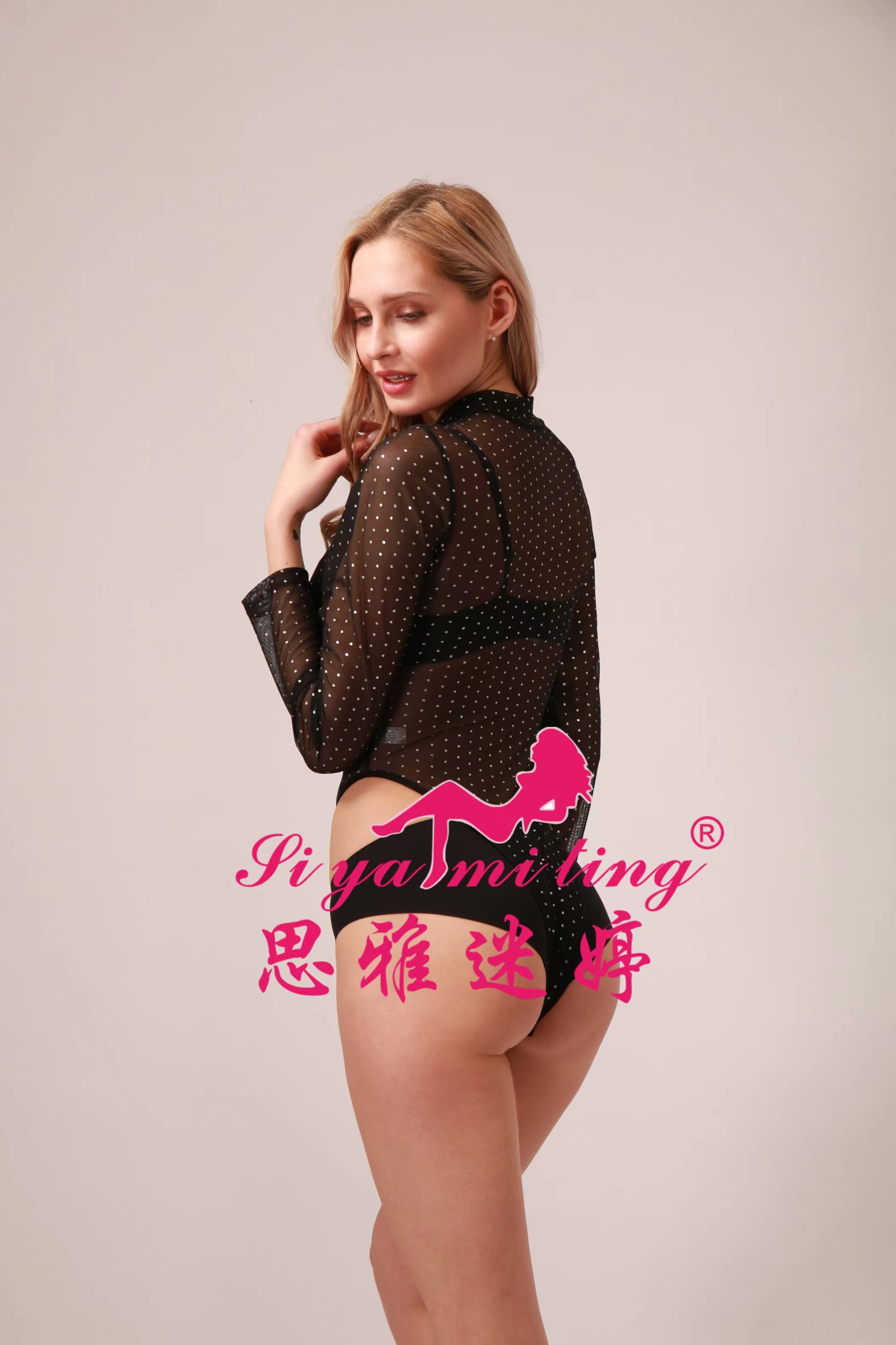 Sexy and seductive long-sleeved, transparent, alluring and charming tight-fitting jumpsuit with cutouts on the bed Item Picture