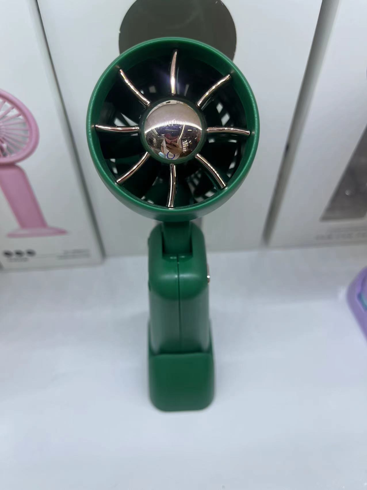 The KD-179 foldable hair dryer fan comes in three colors: white, green and pink. It is a foldable handheld fan that is convenient to carry details Picture