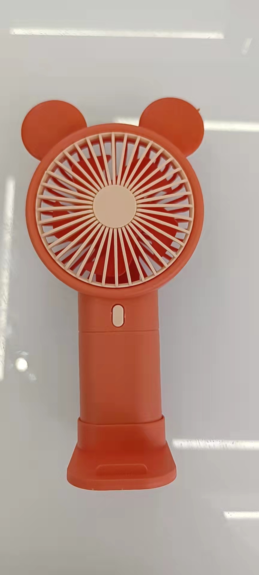 The 933-131 cartoon handheld phone stand fan comes in three colors: blue, green and orange, making it convenient to carry Specification image