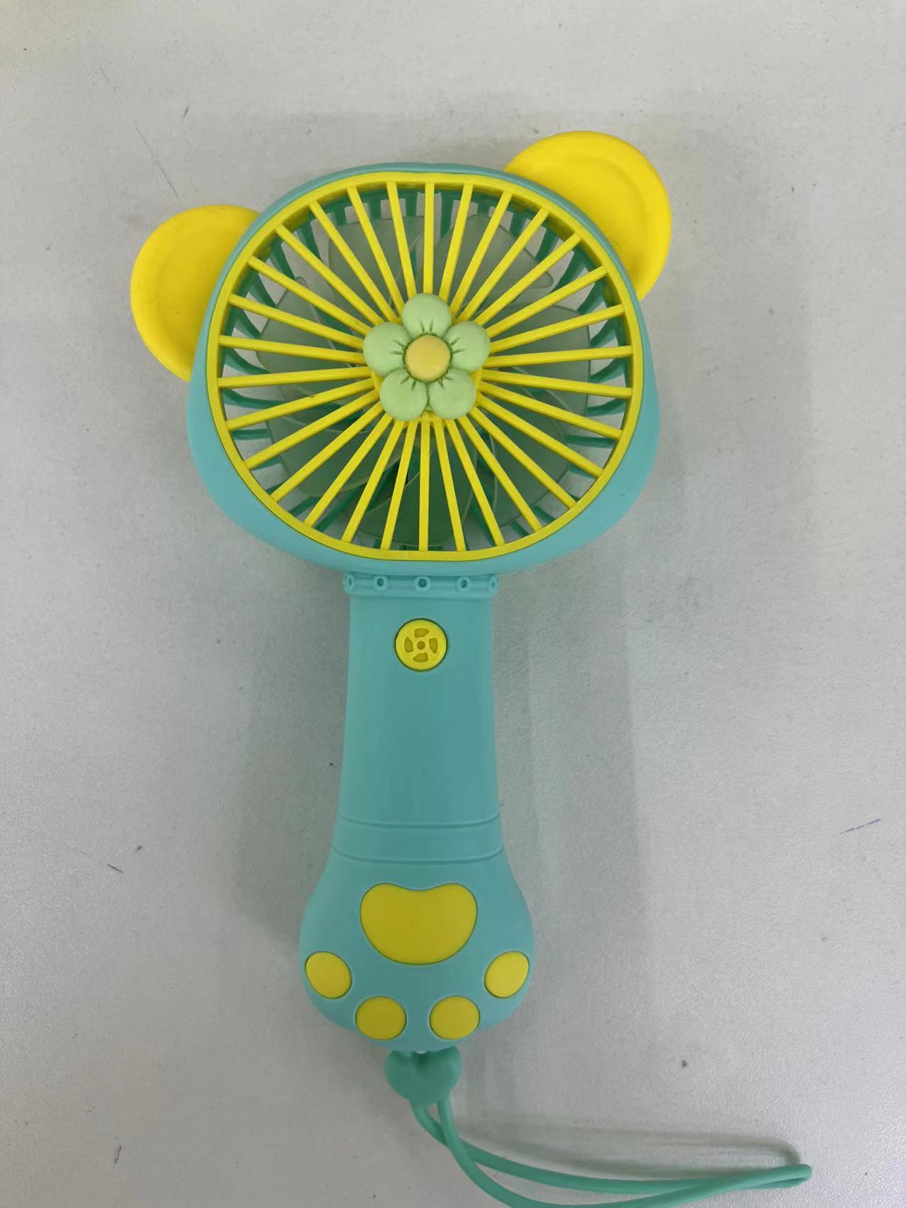 The 2222A mini fan comes in four colors: pink, purple, yellow and green. It is a handheld fan with a single-speed wind force and is easy to carry Application Scenario