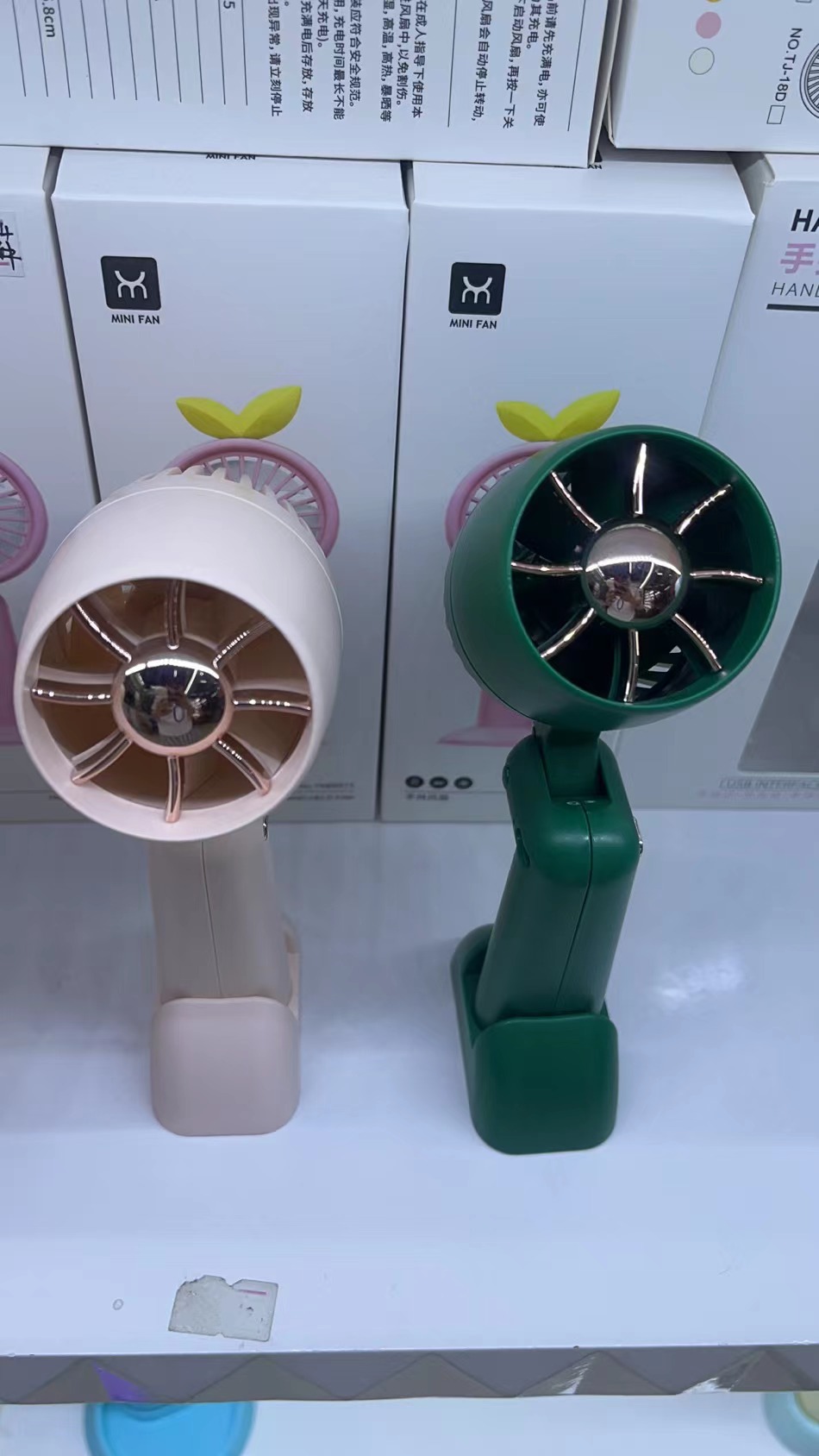 The KD-179 foldable hair dryer fan comes in three colors: white, green and pink. It is a foldable handheld fan that is convenient to carry Item Picture