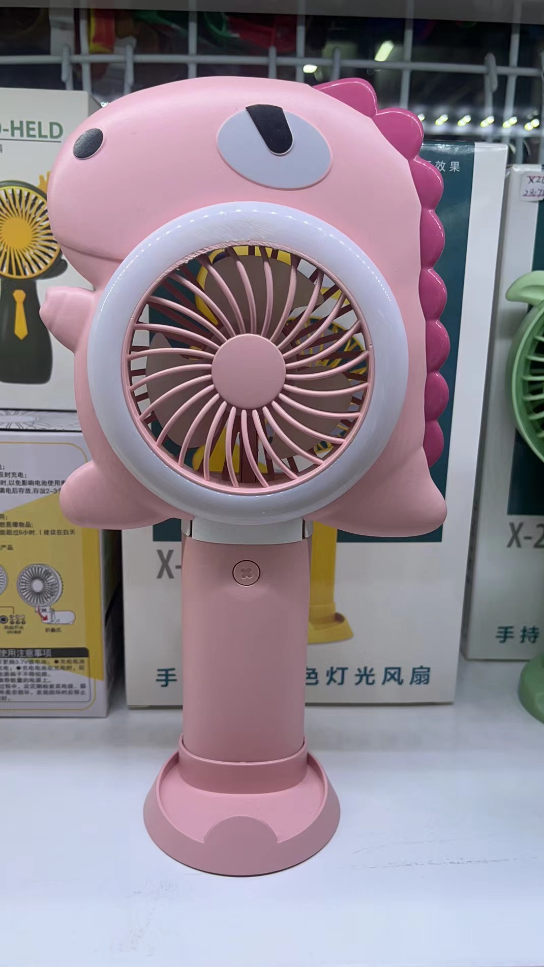The X26 dual-color light folding fan comes in three colors: yellow, pink and green. It can be folded with three wind speeds and is convenient to carry by hand Specification image