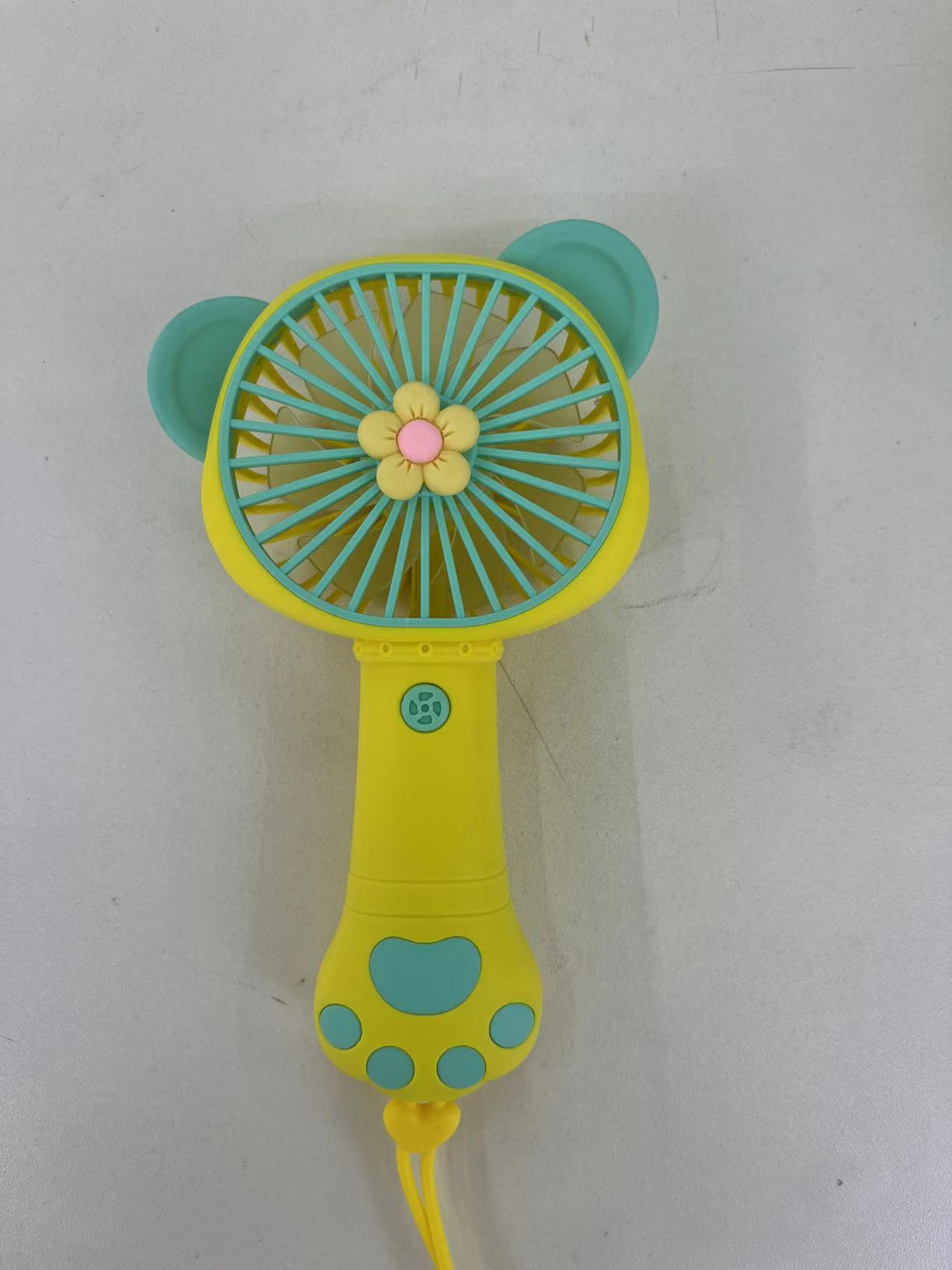 The 2222A mini fan comes in four colors: pink, purple, yellow and green. It is a handheld fan with a single-speed wind force and is easy to carry Item Picture