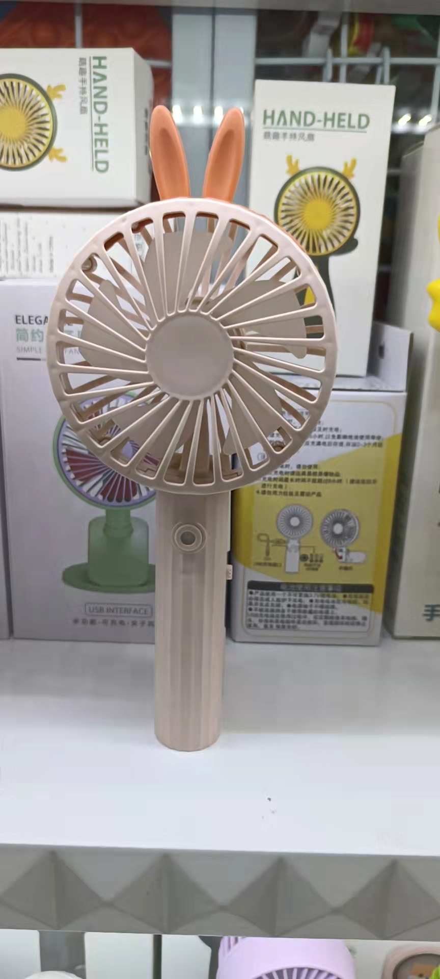 66-25 Spray charging fan in four colors: gray, pink, green and blue. It is a two-in-one handheld fan that can spray water Item Picture