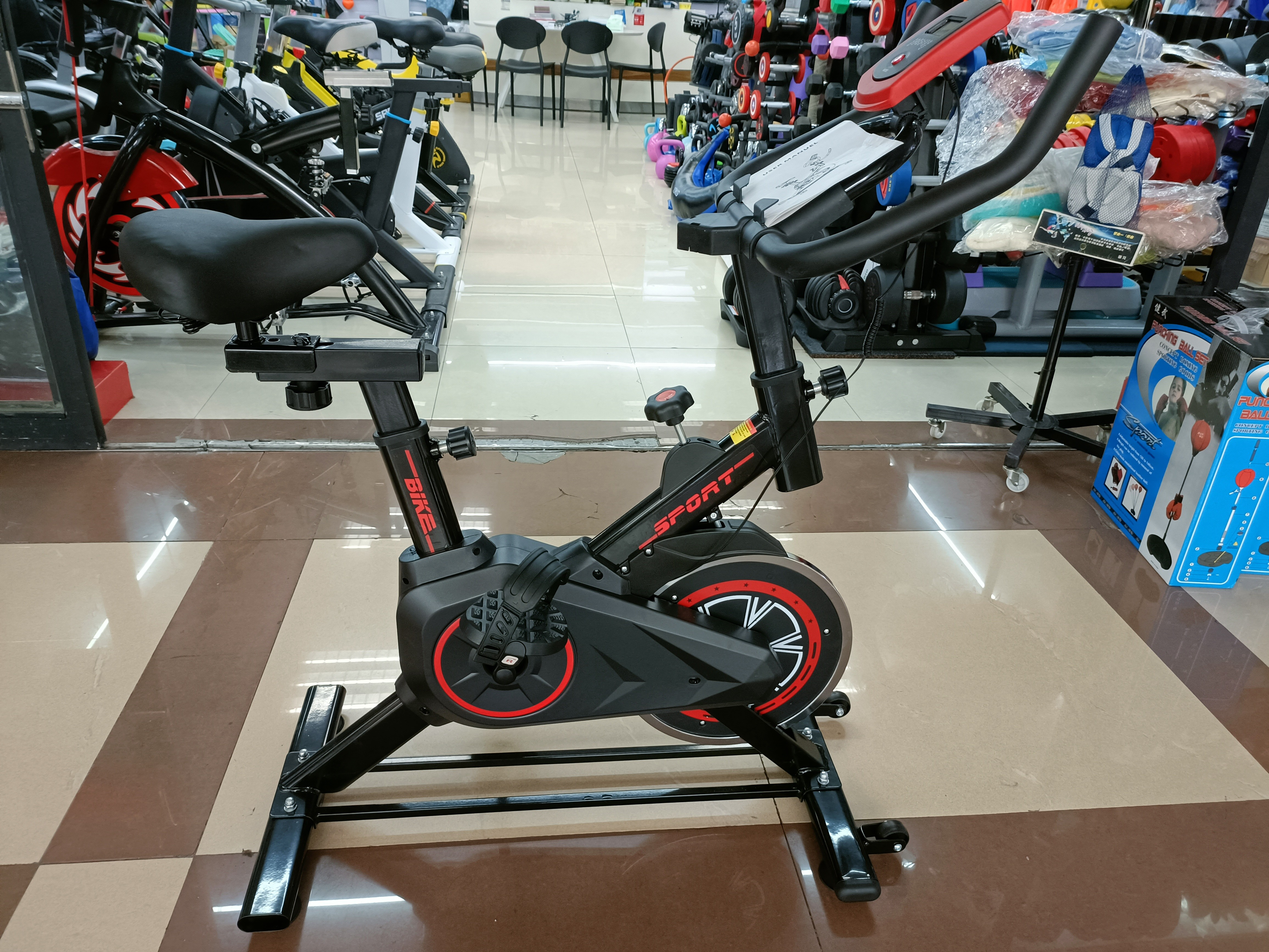 Smart black and red spinning bike for home use