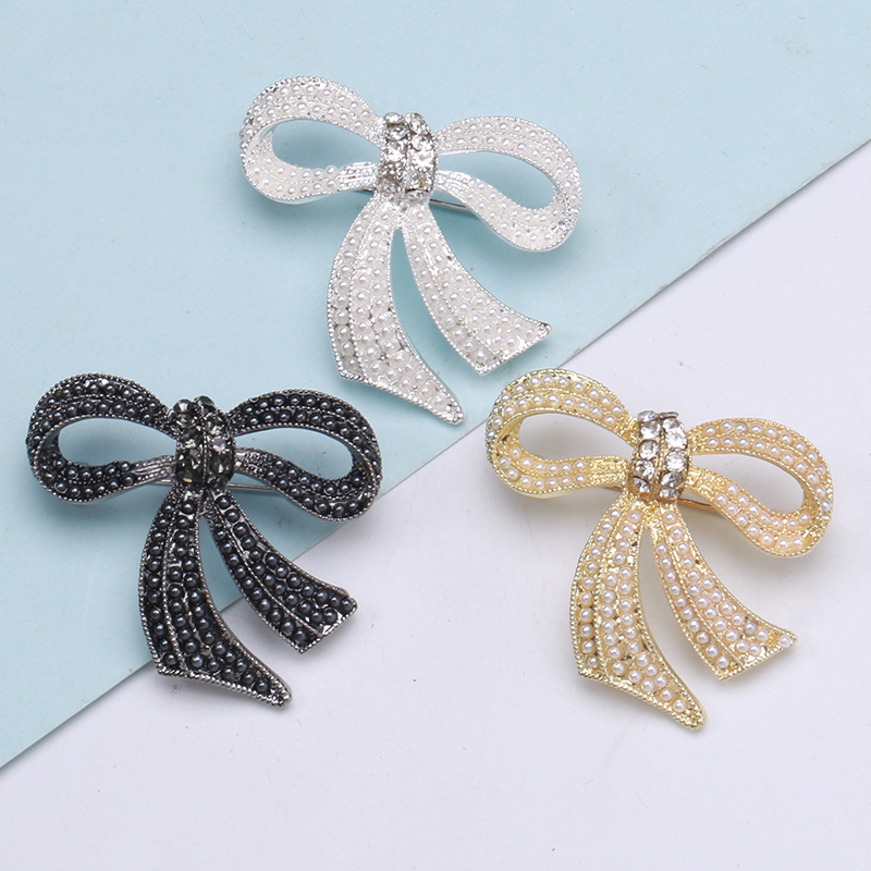 Factory direct sales of creative light luxury Korean version new best-selling cartoon rice bead bow light luxury water diamond creative retro brooch simple and fashionable accessory pin in stock Specification image