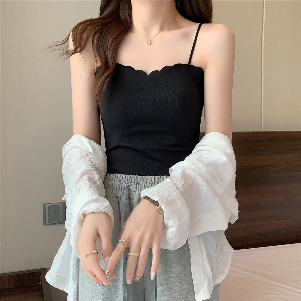 A French-style chic and super popular mini tank top worn over a women's summer bra with a chest pad and a strapless top details Picture