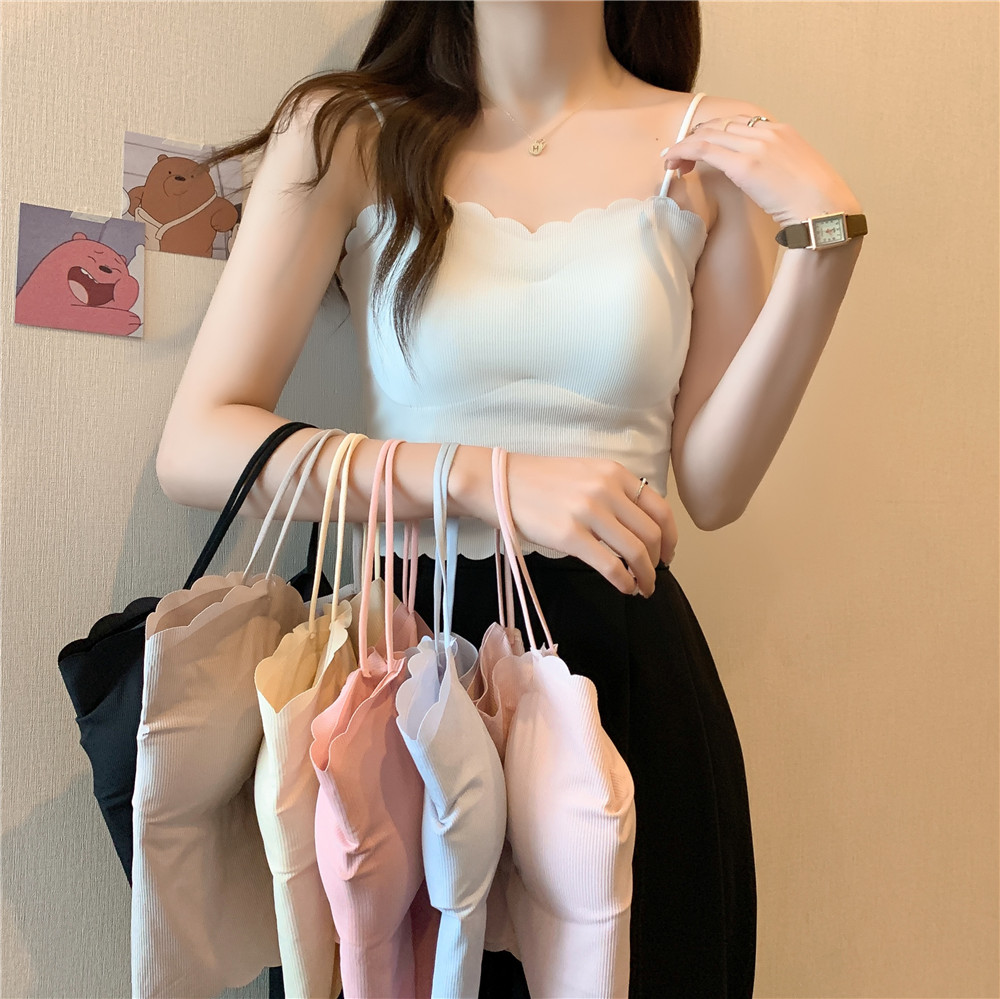 A French-style chic and super popular mini tank top worn over a women's summer bra with a chest pad and a strapless top