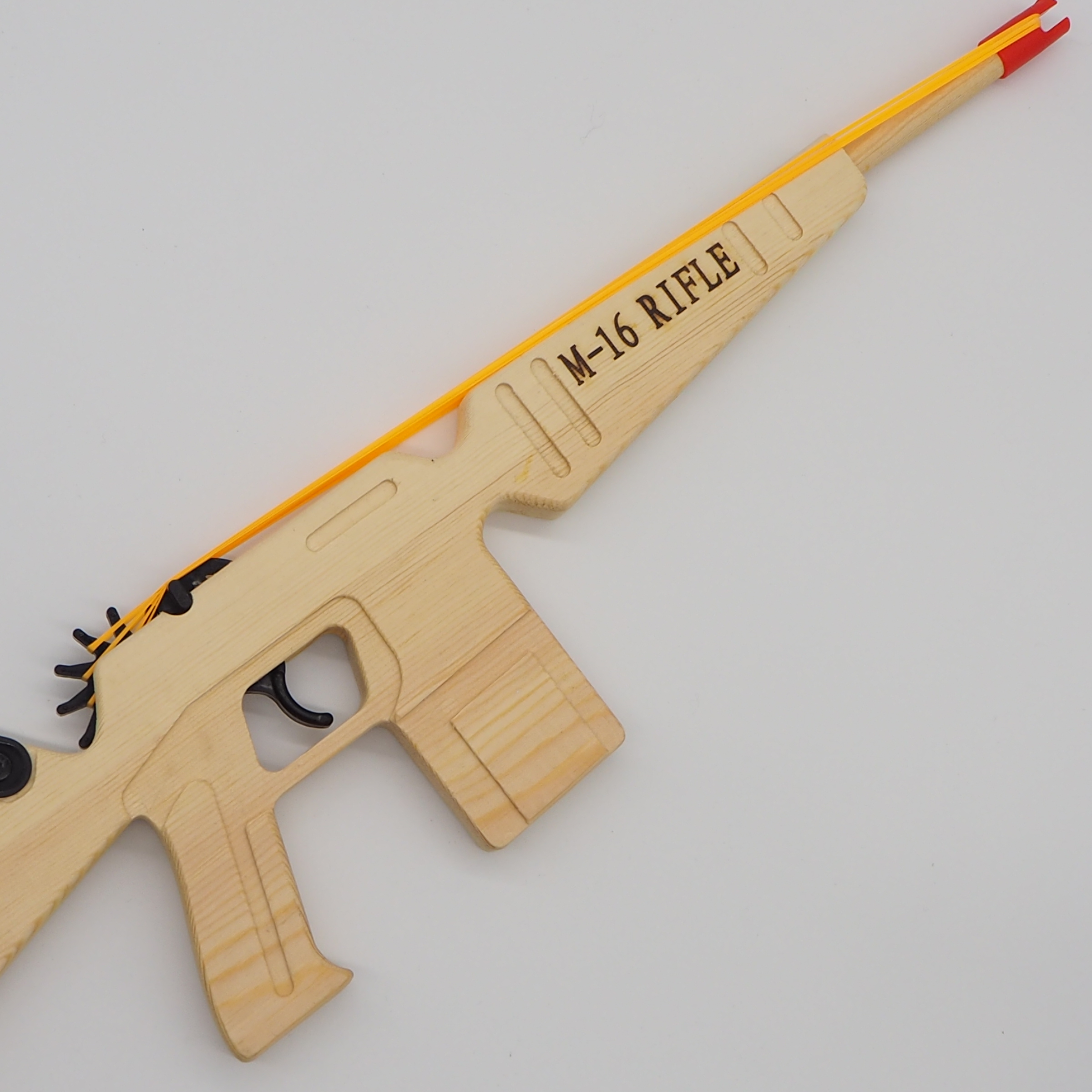 Factory direct sales of rubber band long charge white wood gun, continuous shooting ring gun, pine wood toy gun, M-16 children's toy ring continuous shooting gun Item Picture