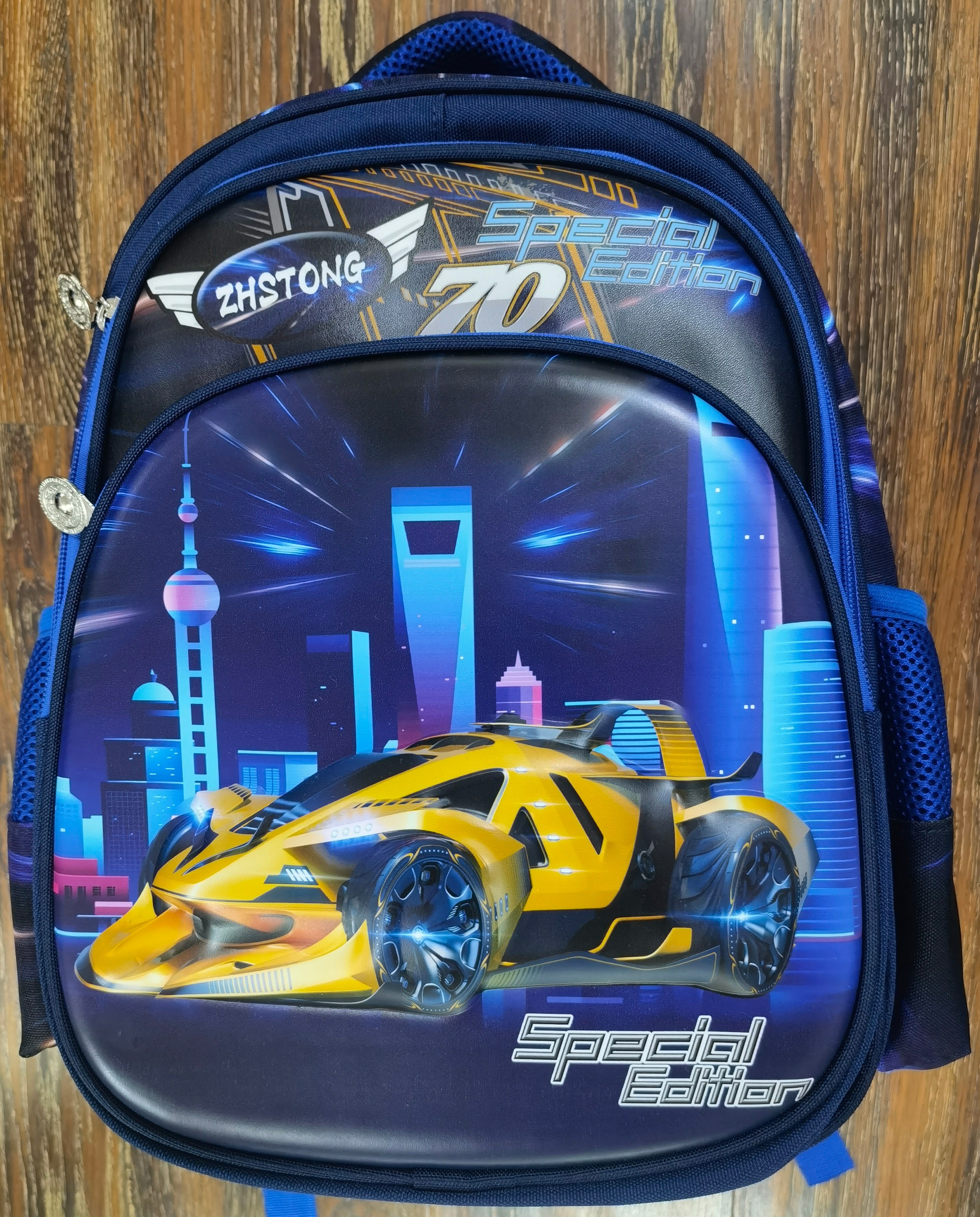A 16-inch single schoolbag with a yellow and blue car