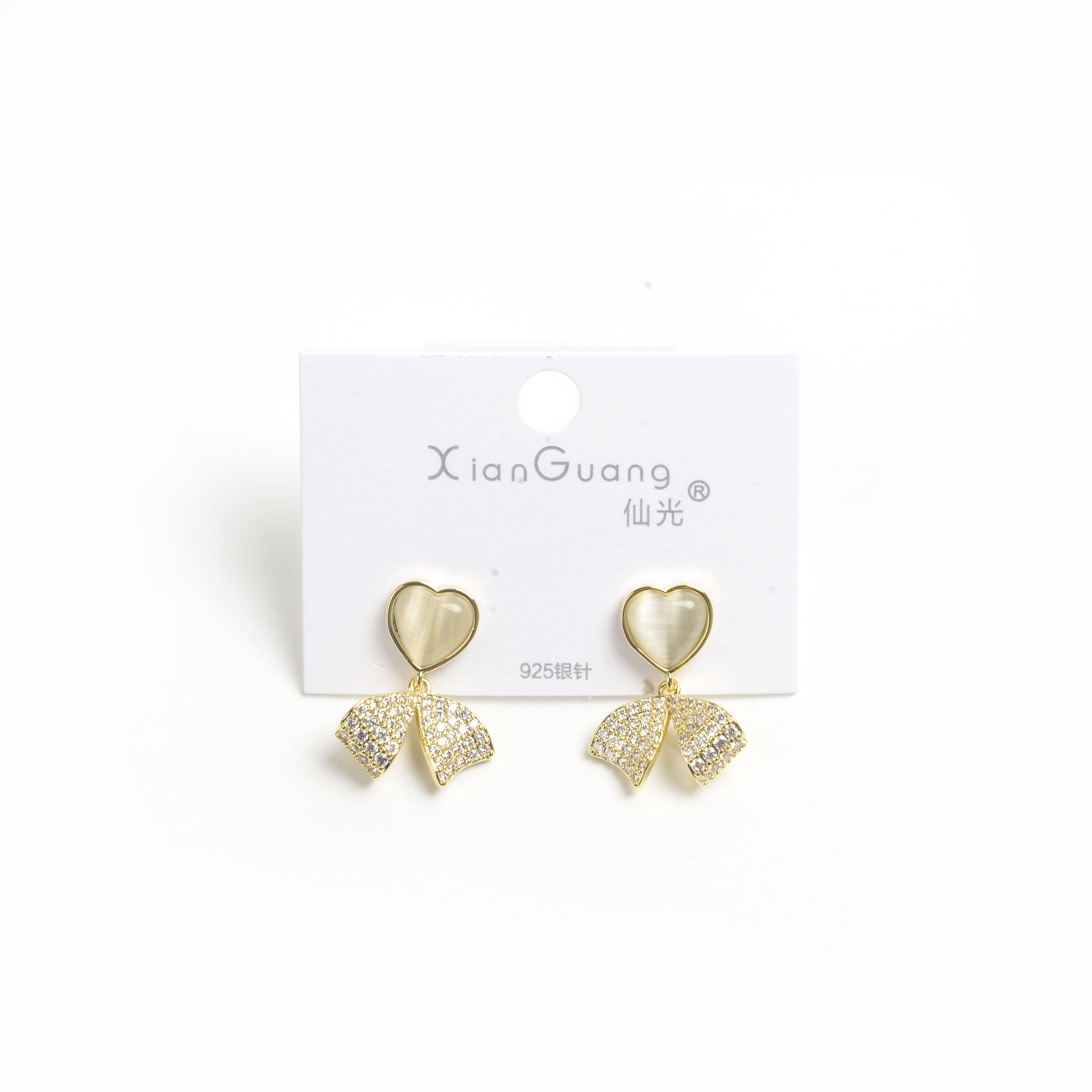 The new earrings feature a niche design with a high-end feel. They are French earrings for women, anti-allergy 925 silver needle, heart-shaped cat's eye stone, bow with diamonds, and fashionable stud earrings Application Scenario