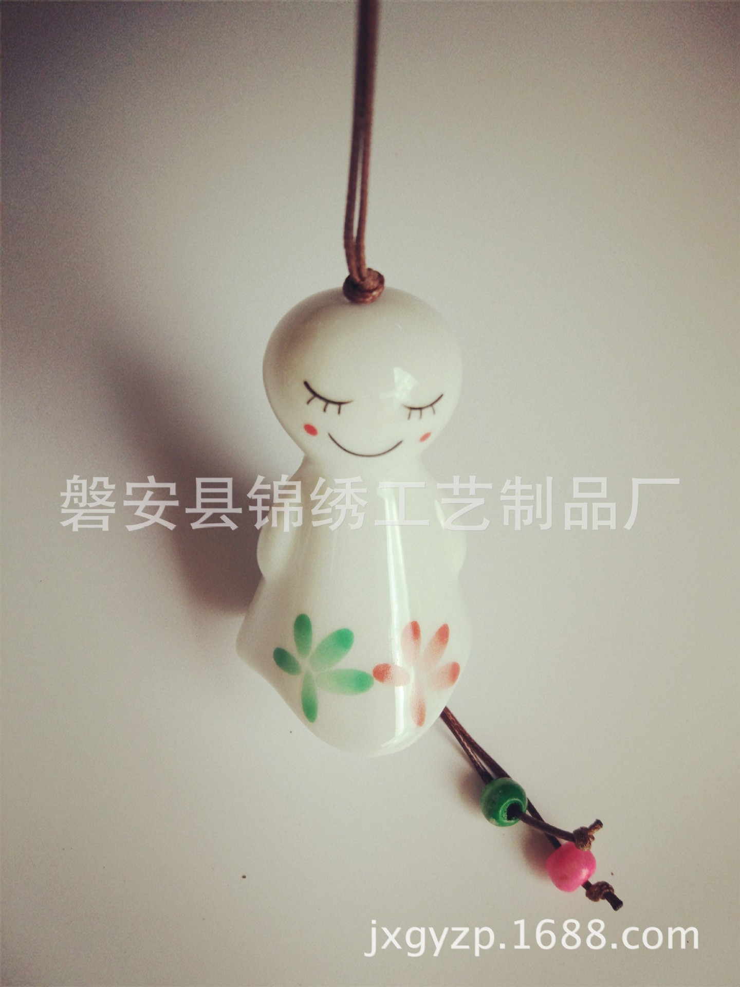 Hot-selling ceramic sunny day doll wind chime, sunny day doll pendant, car hanging, home decoration pendant Application Scenario