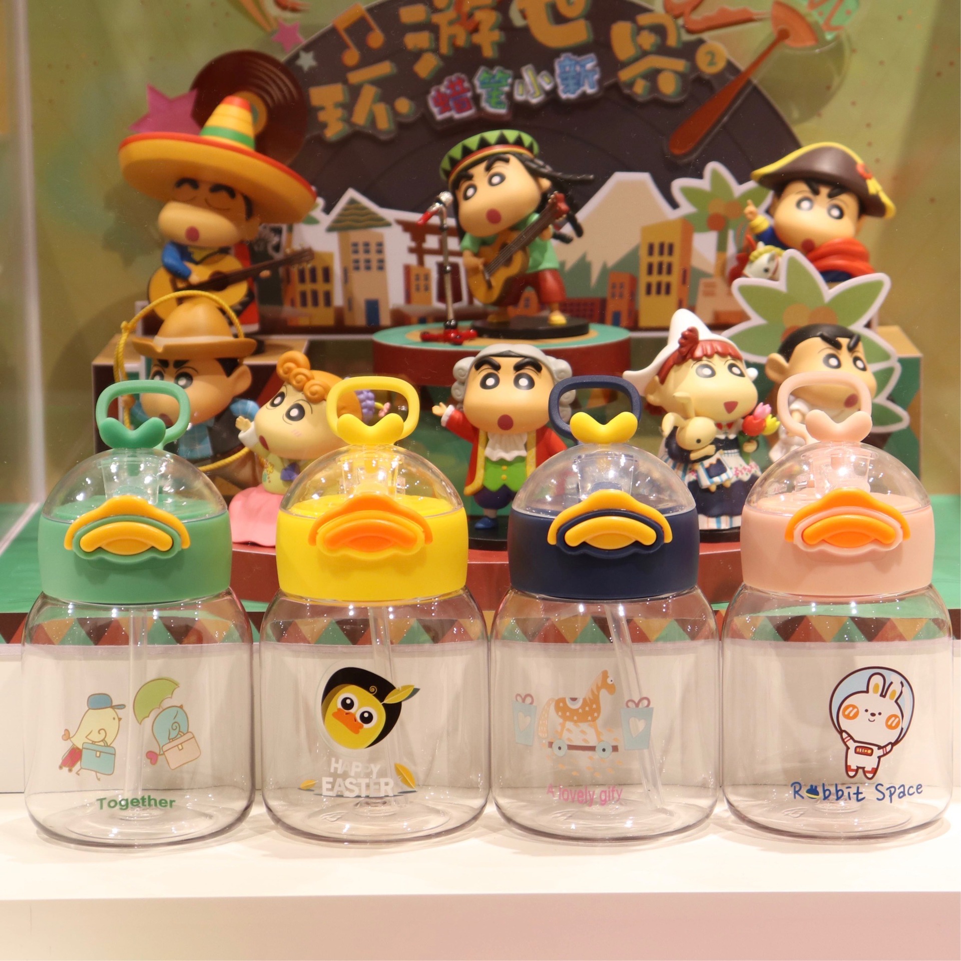 A creative and cute cartoon hand-held plastic cup with a straw Application Scenario