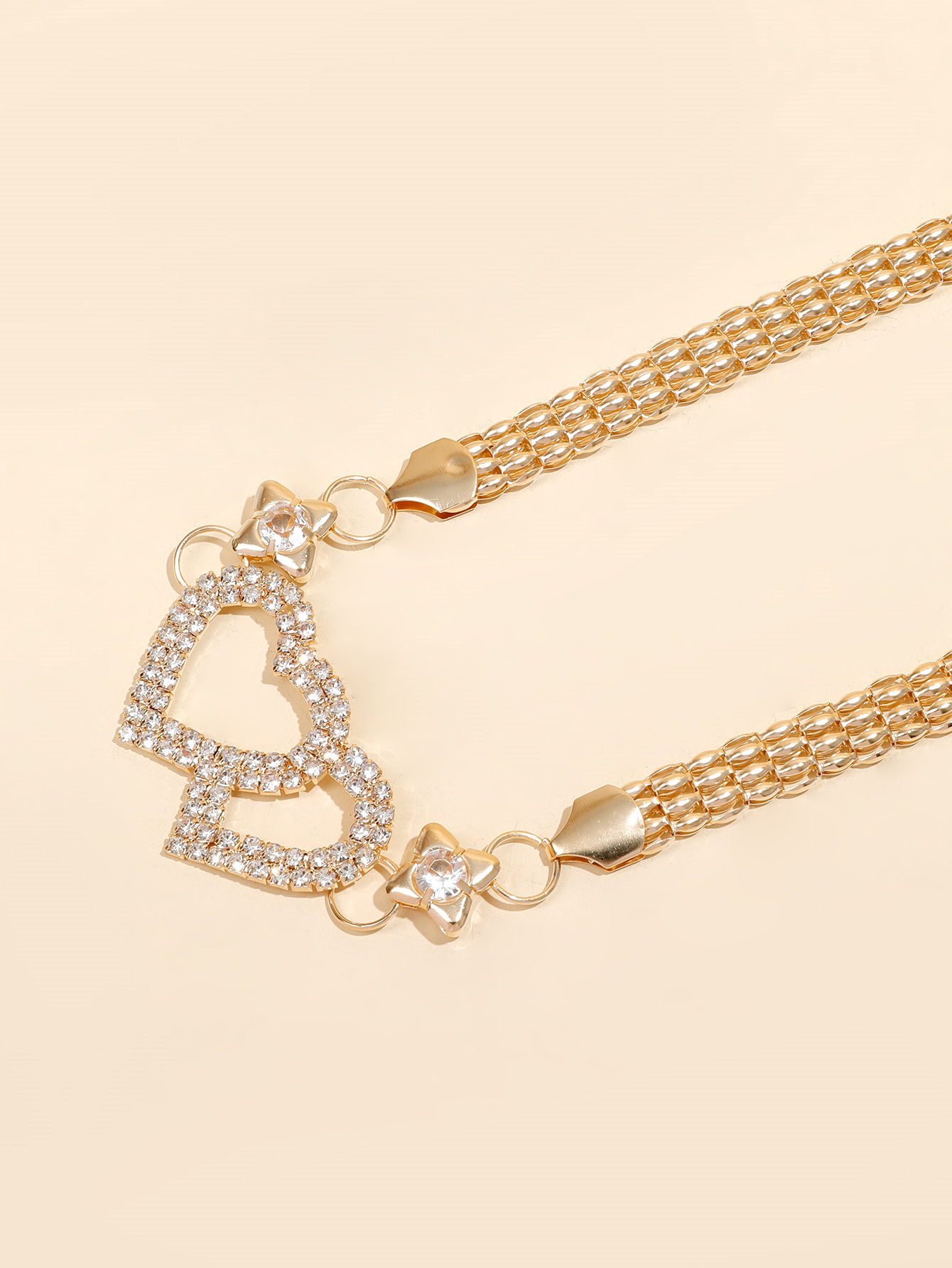 The y21 internet-famous golden metal rhinestone pearl leaf buckle spring elastic band pairs well with the thin waist chain belt of the pants for a trendy female look Item Picture