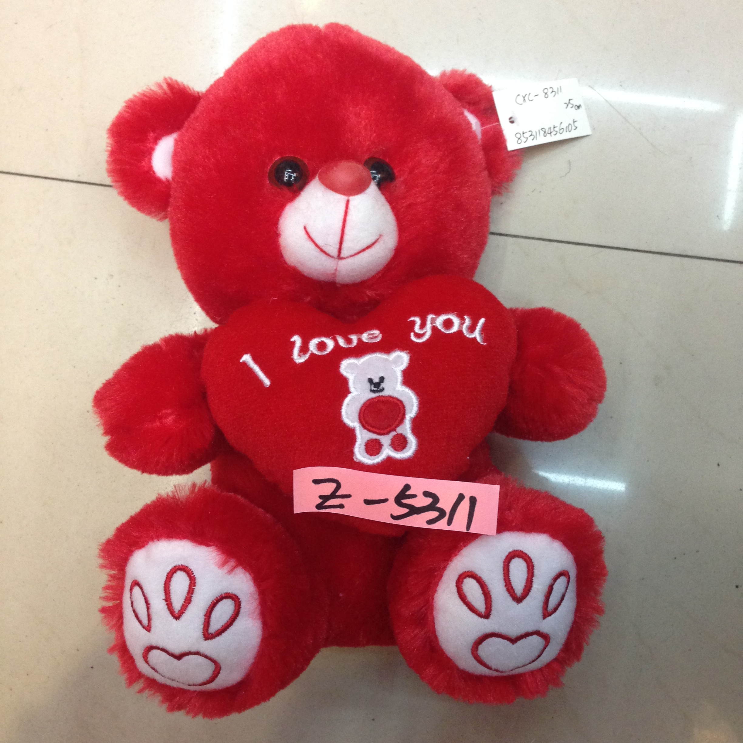 Yiwu Small Commodities City, a 25-centimeter heart-shaped bear, red in color, with feet