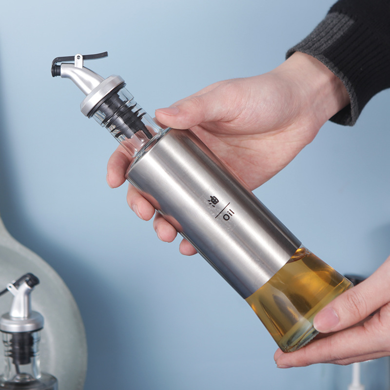 A Japanese-style stainless steel oil bottle for the kitchen, a press-type soy sauce bottle