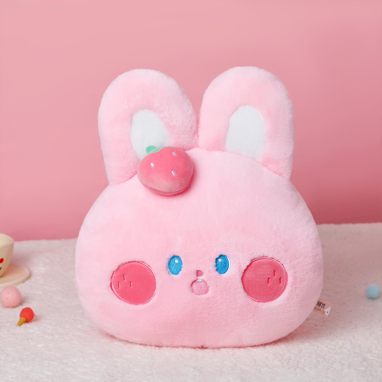 The cute strawberry pink rabbit plush pillow is decorated with a cute shape, is skin-friendly and delicate, and has a smooth touch