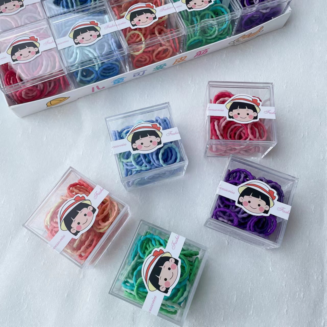 Dingdian No.1 Store's basic high-elasticity children's candy-colored small square box super value hair band rubber band A20977 Application Scenario