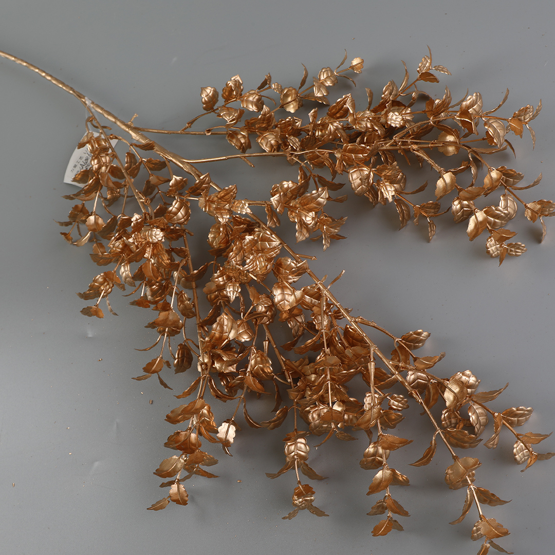 Artificial flowers with golden plastic leaves for home decoration