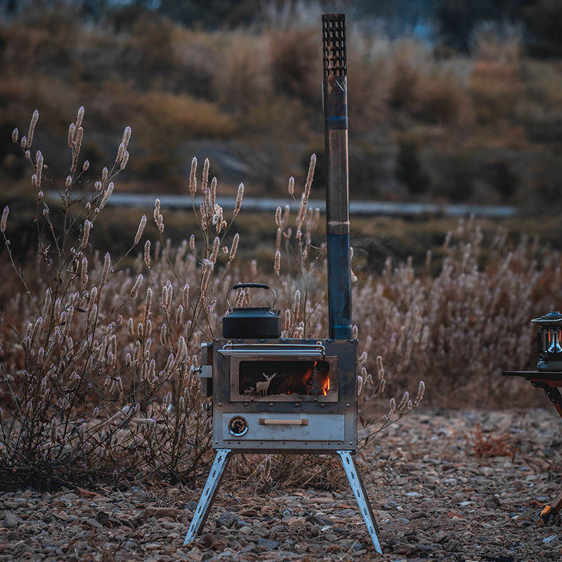 Xanoduji outdoor tent uses a portable camping stove with a chimney, a stove inside the tent, and a yurt tent heating stove details Picture