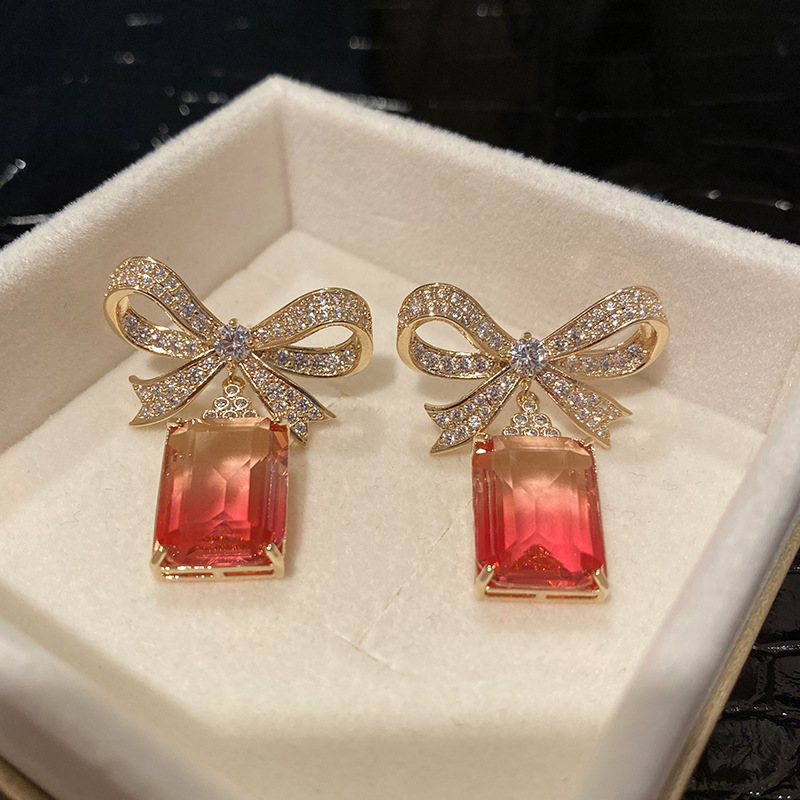 Bow red diamond stud earrings in tourmaline color with a translucent texture, stir-fried simple, sweet and elegant crystal earrings Application Scenario