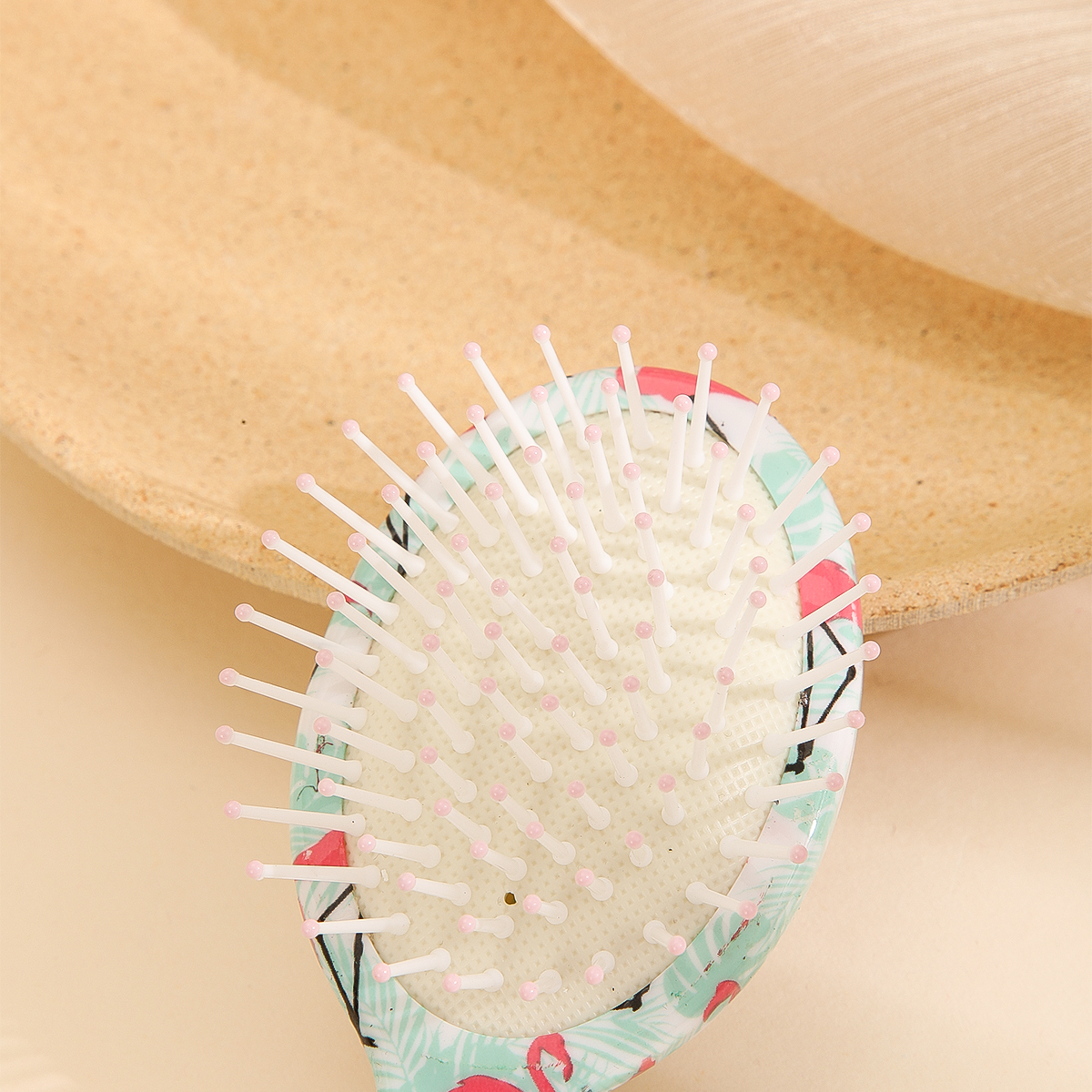 The small and mini airbag comb for women is not harmful to the scalp. It is a plastic comb and a cute cartoon airbag comb details Picture